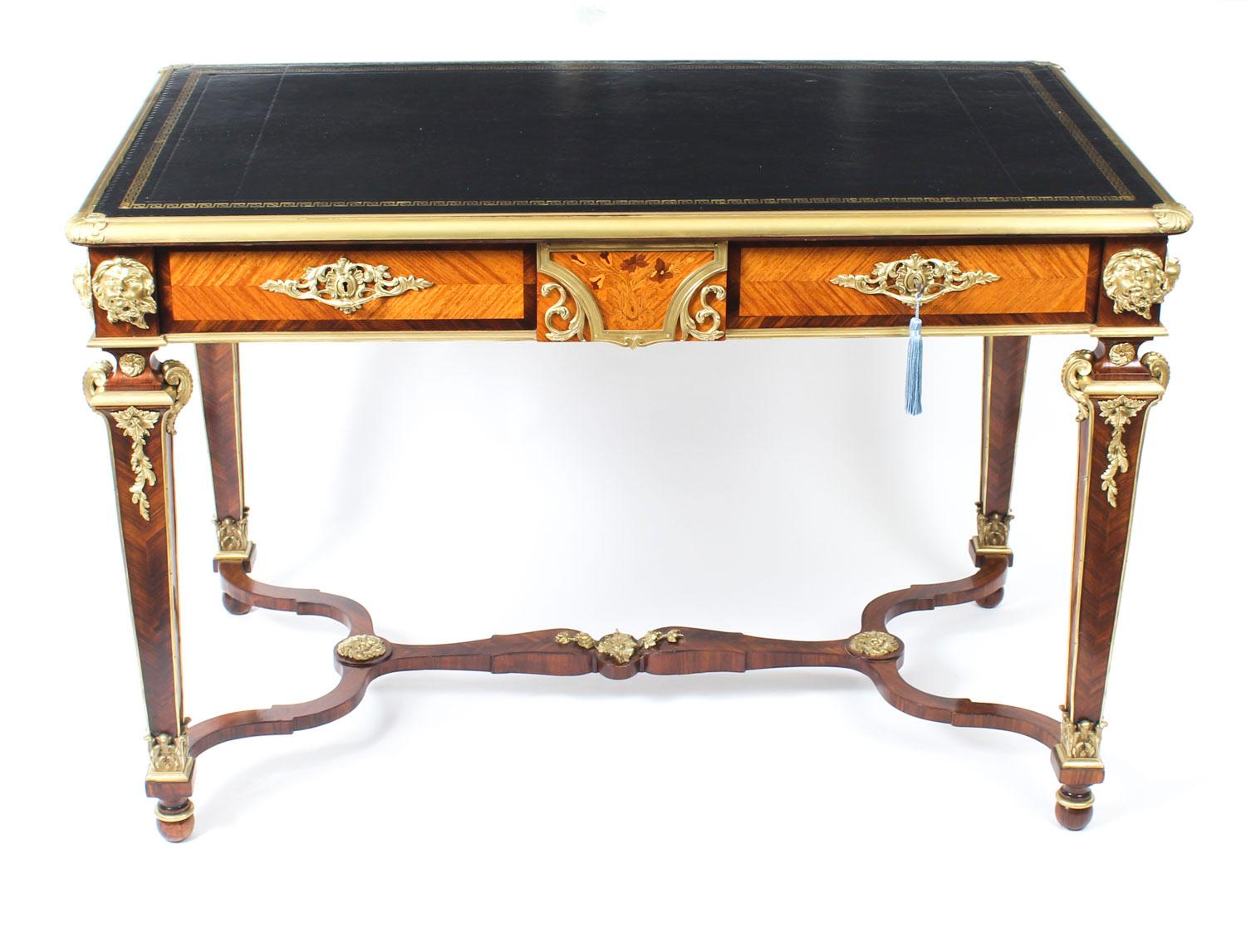 A superb antique 19th century French kingwood, marquetry and ormolu mounted bureau plat, circa 1860 in date.

The rectangular top with ormolu border and fitted with a striking gold tooled black leather writing surface. The decorative frieze with