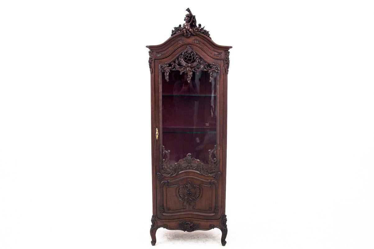 A historic display vitrine from the late 19th century.
Furniture in very good condition, after renovation. 
Made in France in late 19th century. 
Made of walnut wood 
Dimensions: height 206 cm / width 73 cm / depth 48 cm