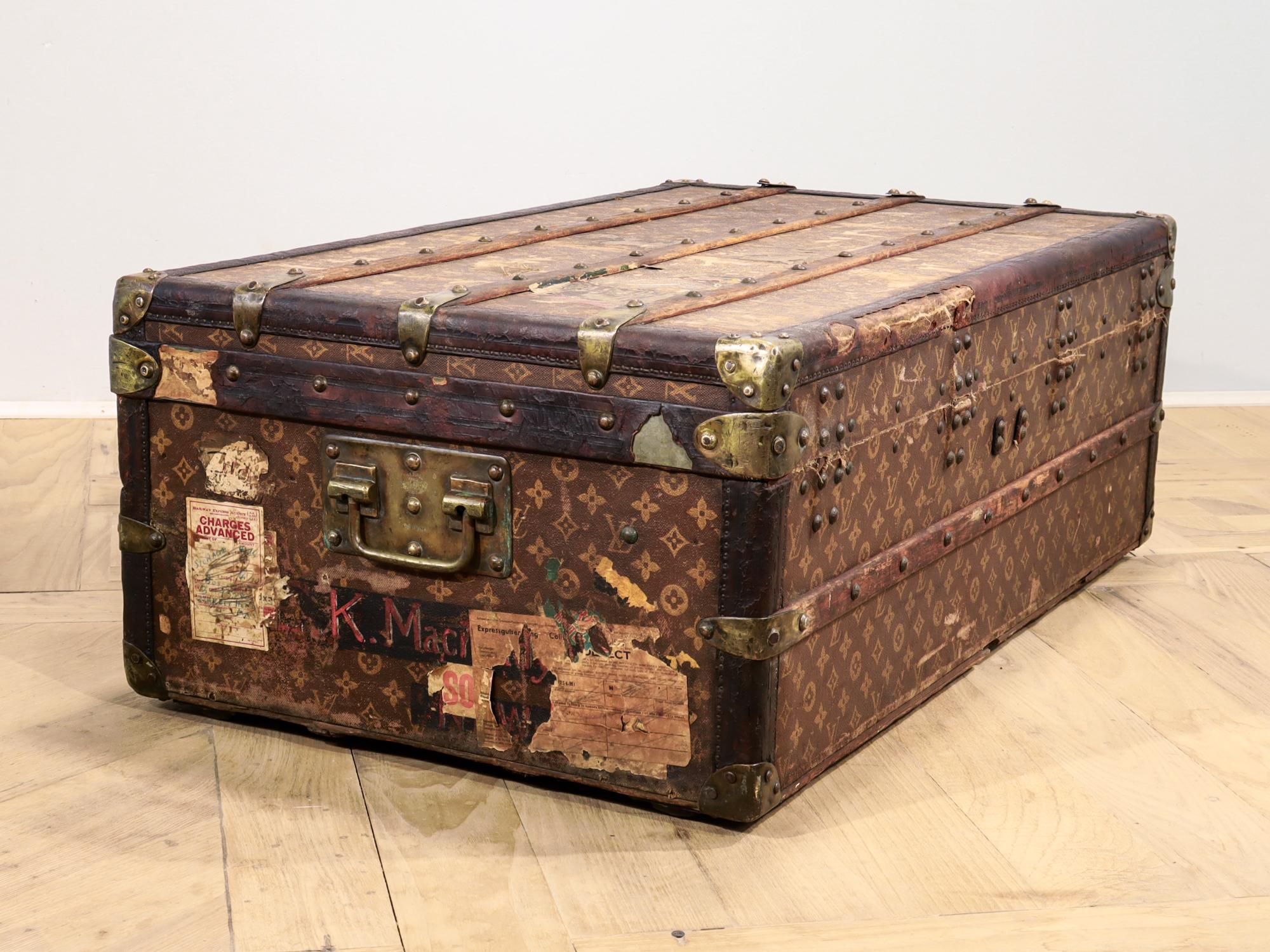 An early 20th Century steamer cabin trunk.

By Louis Vuitton.

With a early hand stenciled monogram canvas, beech wood slats, leather trim and LV stamped brass clasps, handles, and rivets.

The linen-lined interior retains the original quilting to