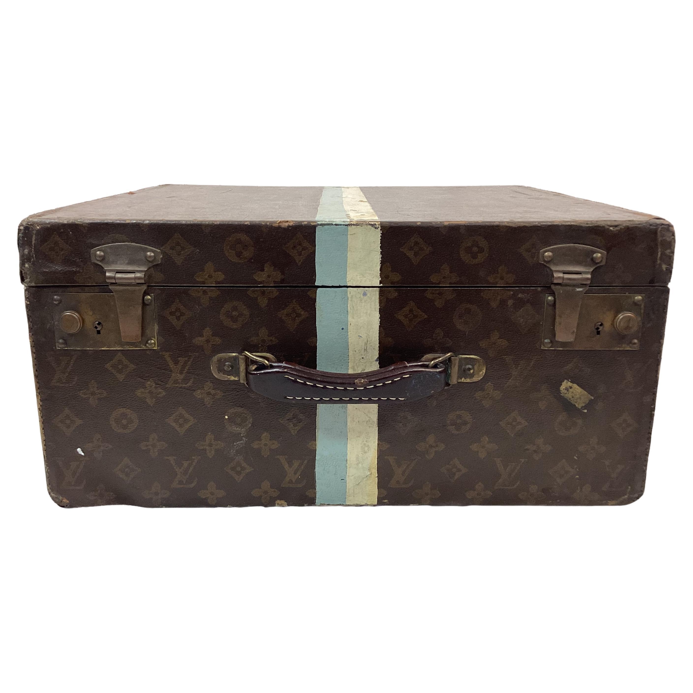 Rare antique French early 20th century Louis Vuitton monogrammed luggage cube trunk. Features previous owners initials along with blue and white stripes. Authentic Louis Vuitton label on inner top. 