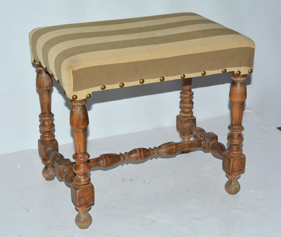 Louis XIII style stool or ottoman with turned leg and stretcher.