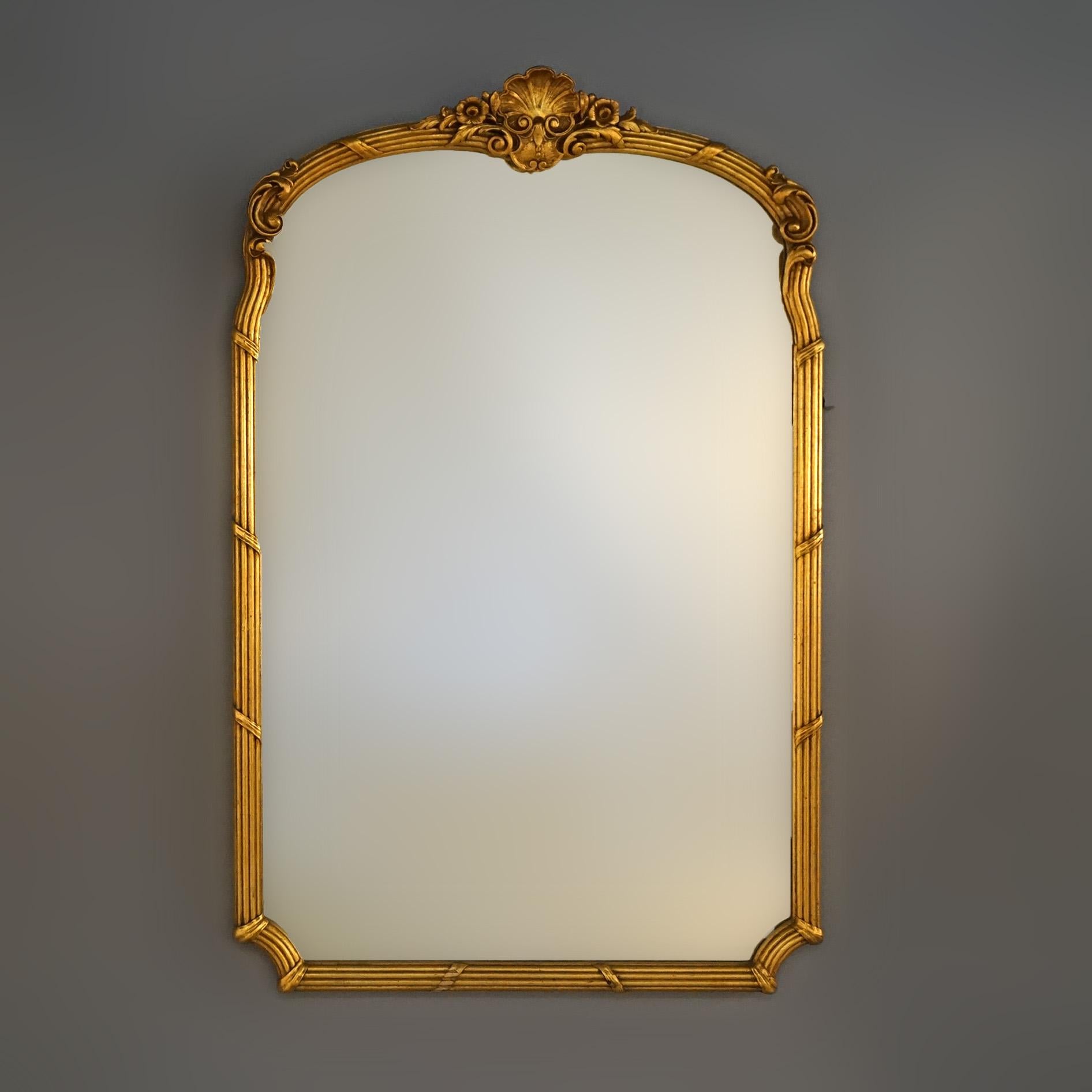 Antique French Louis XIV Giltwood Wall Mirror with Shell & Floral Elements on Reed Frame C1930

Medidas - 42,5 