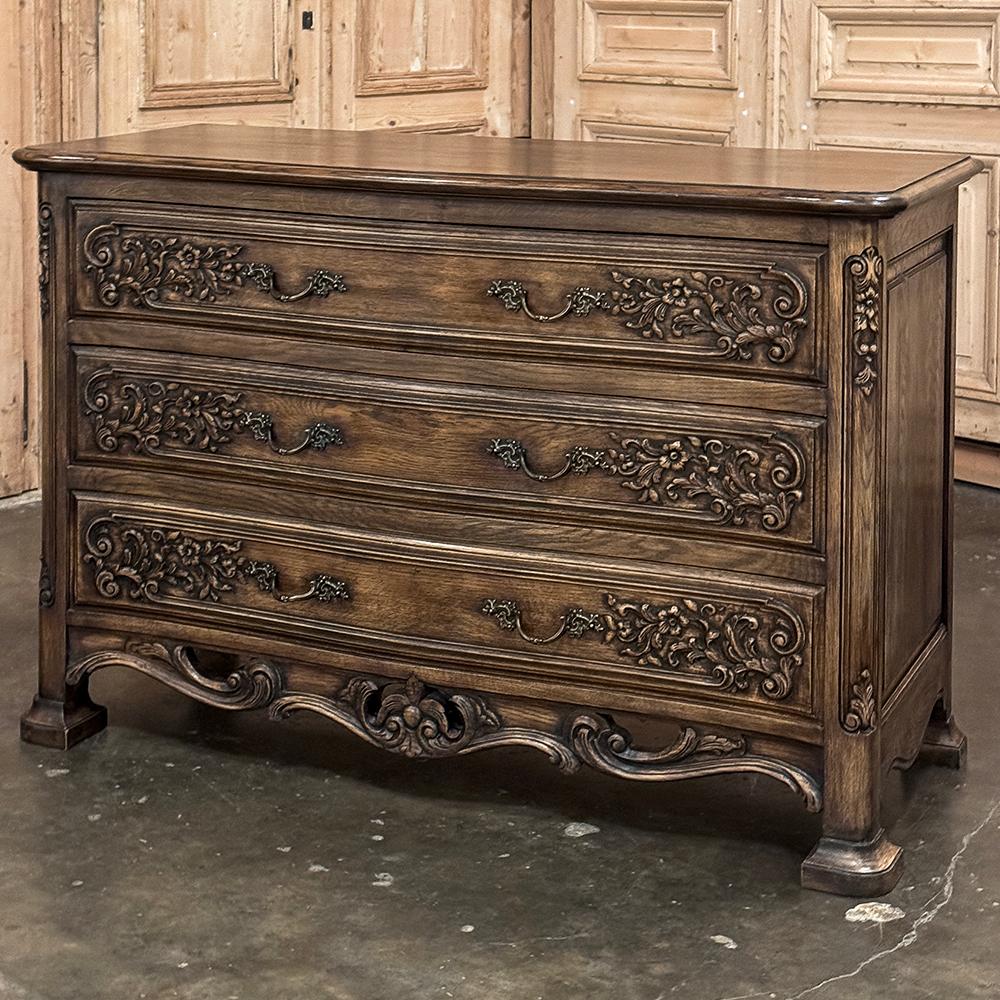 Antique Louis XIV Oak Commode was literally made to last for generations!  Hand-crafted from solid oak, even on the back with chamfered plank panels, it features a gracefully bowed front facade which is reflected in the contours of the beveled top. 