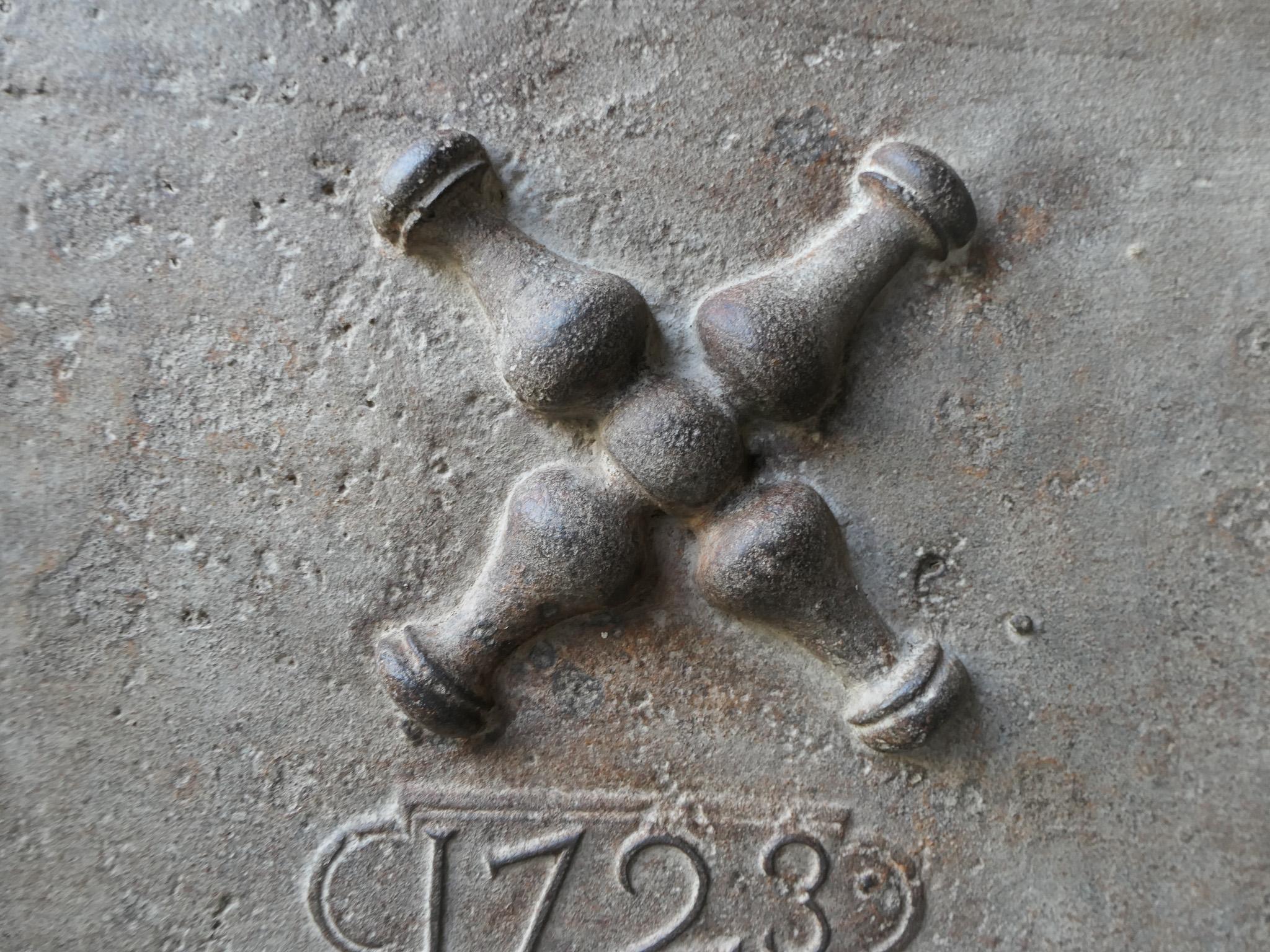 18th century French fireback with a Saint Andrew's cross and two pillars of Hercules. Saint Andrew is said to have been martyred on a cross in this shape. As a result the cross became a sign for humility and sacrifice. The pillars of Hercules