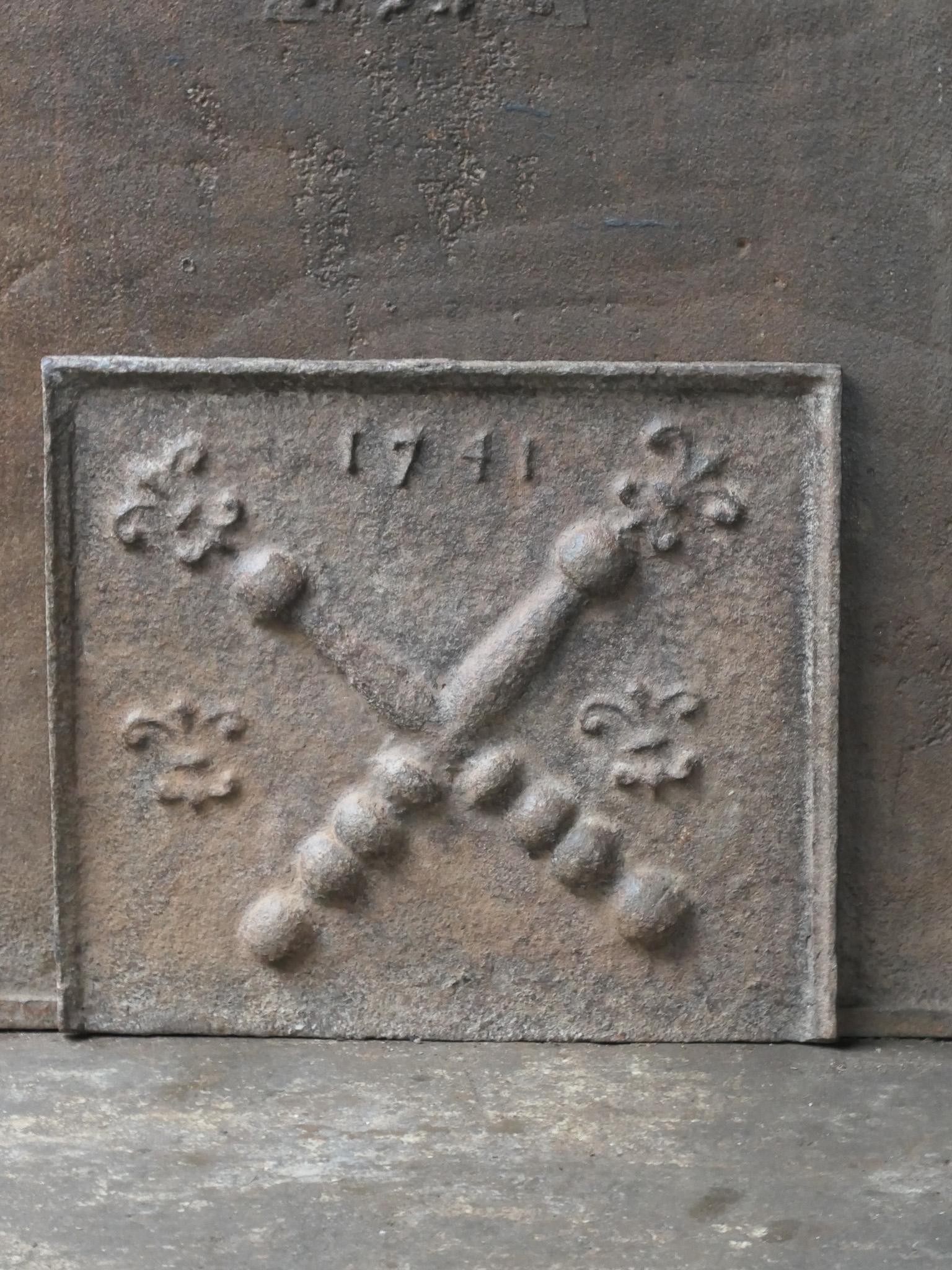 18th century French fireback with a Saint Andrew's cross and two pillars of Hercules. Saint Andrew is said to have been martyred on a cross in this shape. As a result the cross became a sign for humility and sacrifice. The pillars of Hercules