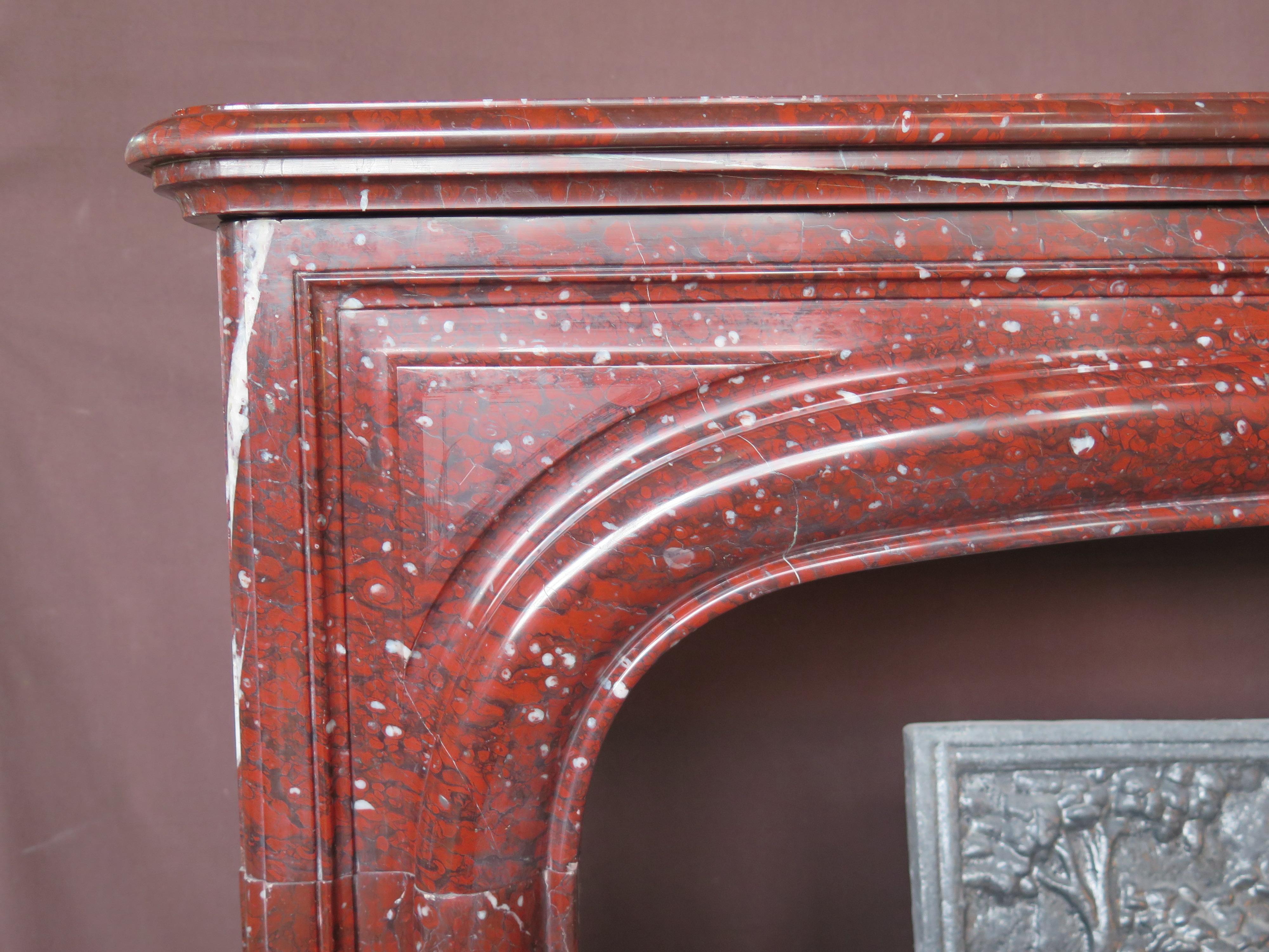 Antique Louis XIV style 19th century red griotte marble mantel

 A large molding underlines the opening on the hearth.