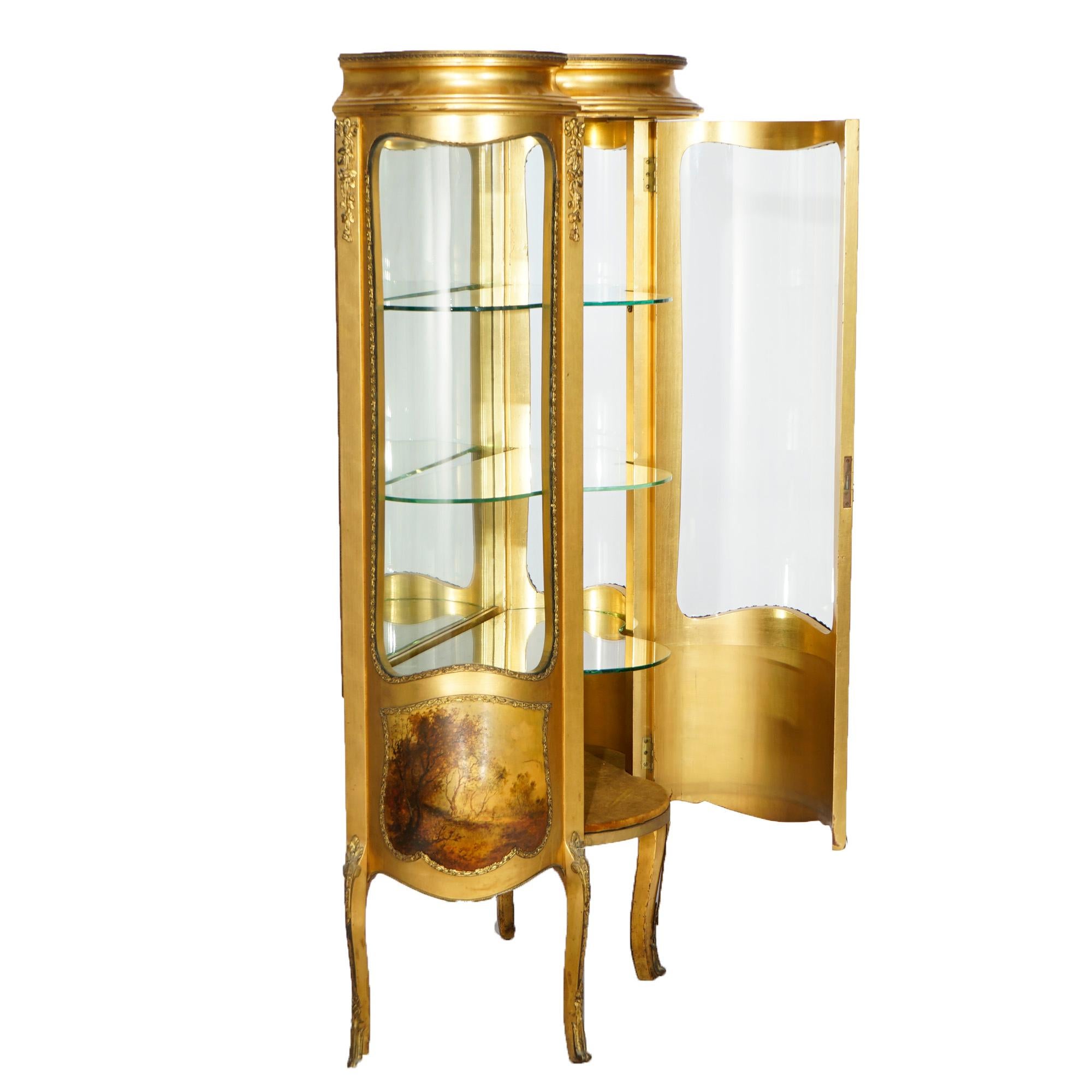 An antique French Louis XIV style vitrine offers giltwood construction in bombe form having curved glass, Vernis Martin decoration, and cast ormolu mounts, raised on cabriole legs, 19th century.

Measures- 57.25''H x 29''W x 17.75''D.

Catalogue