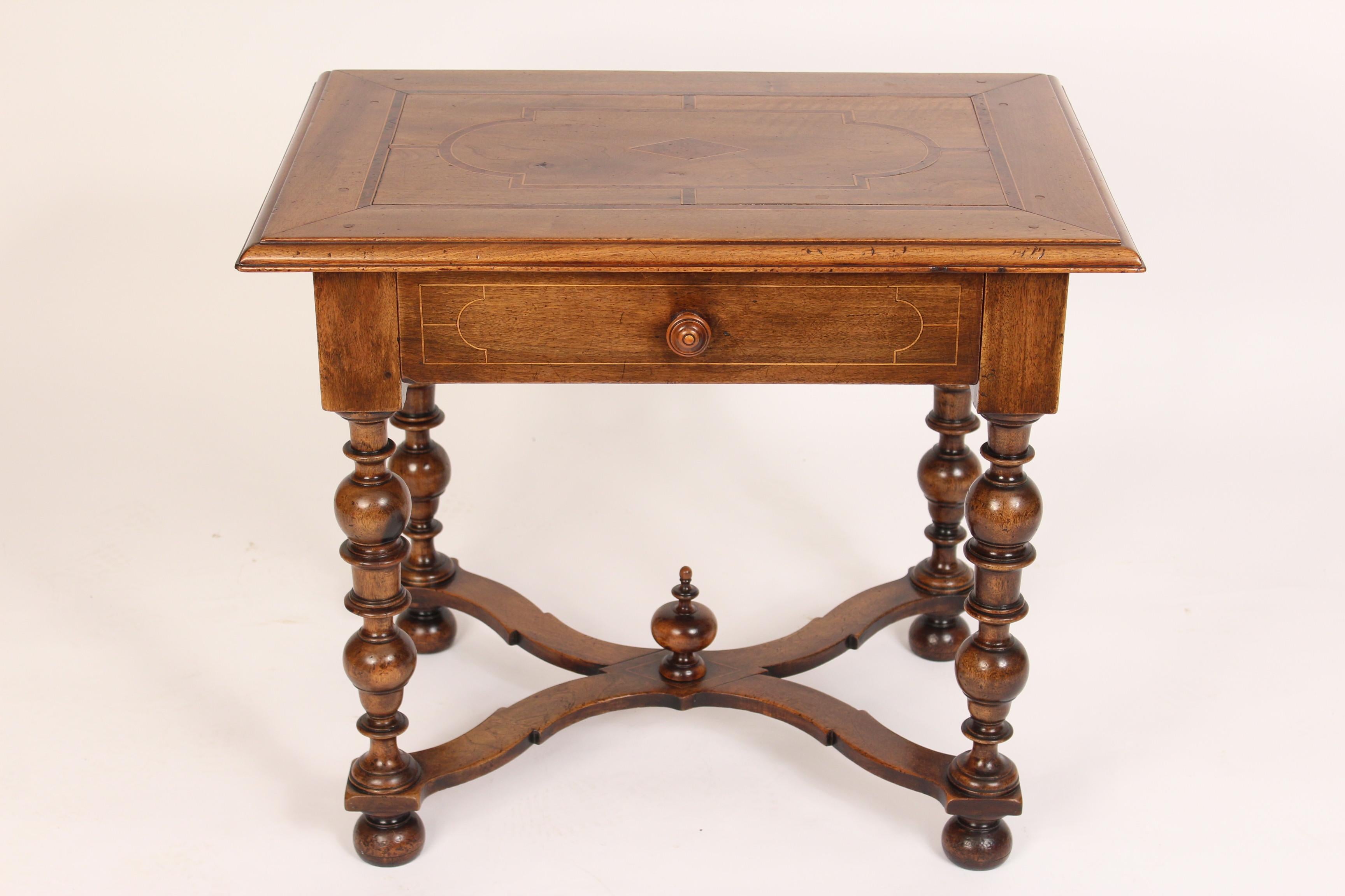 Antique Louis XIV style walnut occasional table, 19th century. With an inlaid top, X-shaped stretcher bar, turned legs and dovetail construction on the drawer.
