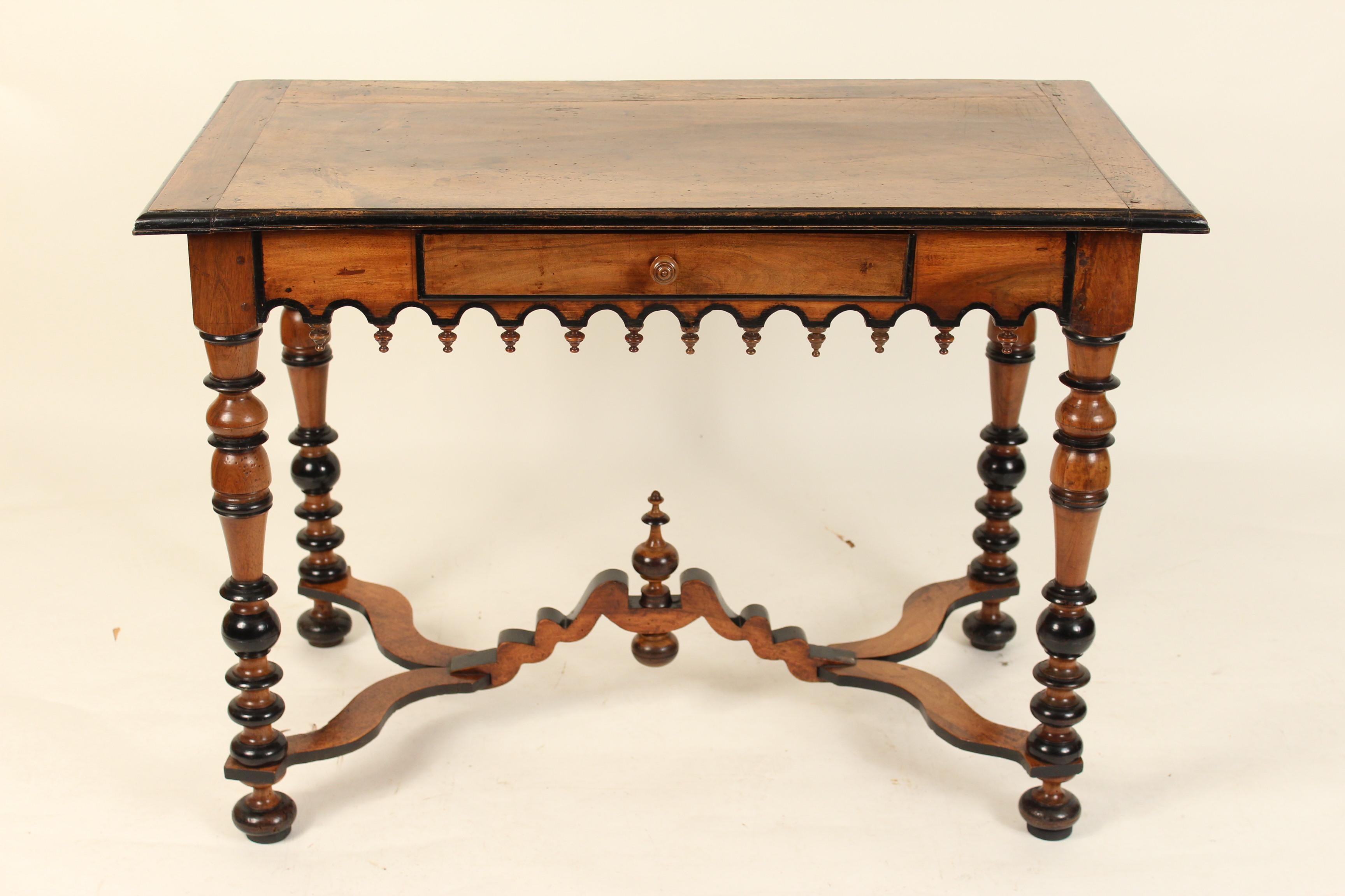 Continental antique Louis XIV style walnut writing / occasional table, 19th century. With a nice old patina and ebonized trim.