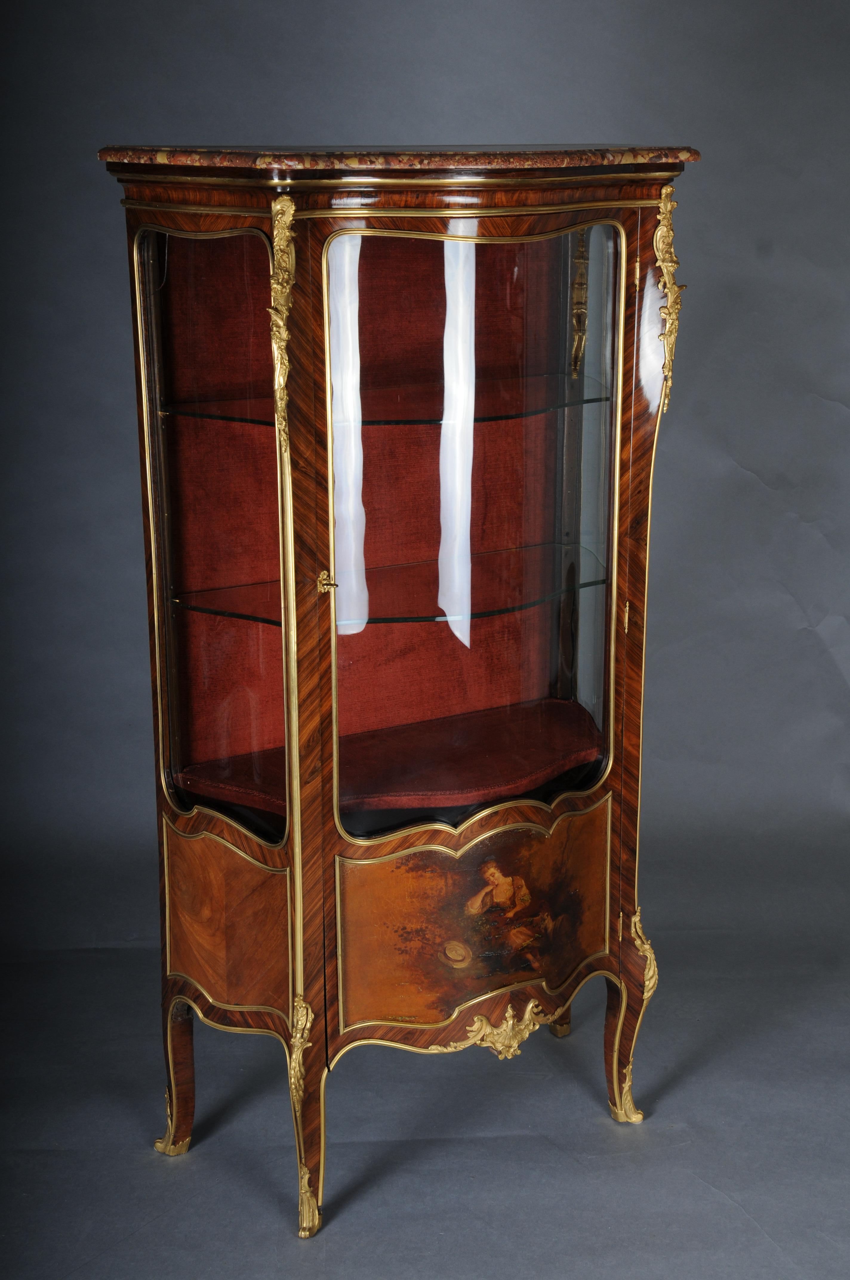 Antique Louis XV display cabinet Napoleon III, Paris, around 1880

Fine veneer on solid oak, veneered and paneled with ebony inlays. Arched, single-door body (solid oak) with red-beige veined marble top. Three-sided glazing with rounded corners.
