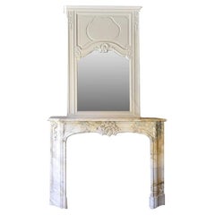 Antique Louis XV firplace mantle with mirror and cast iron interior 19th Century