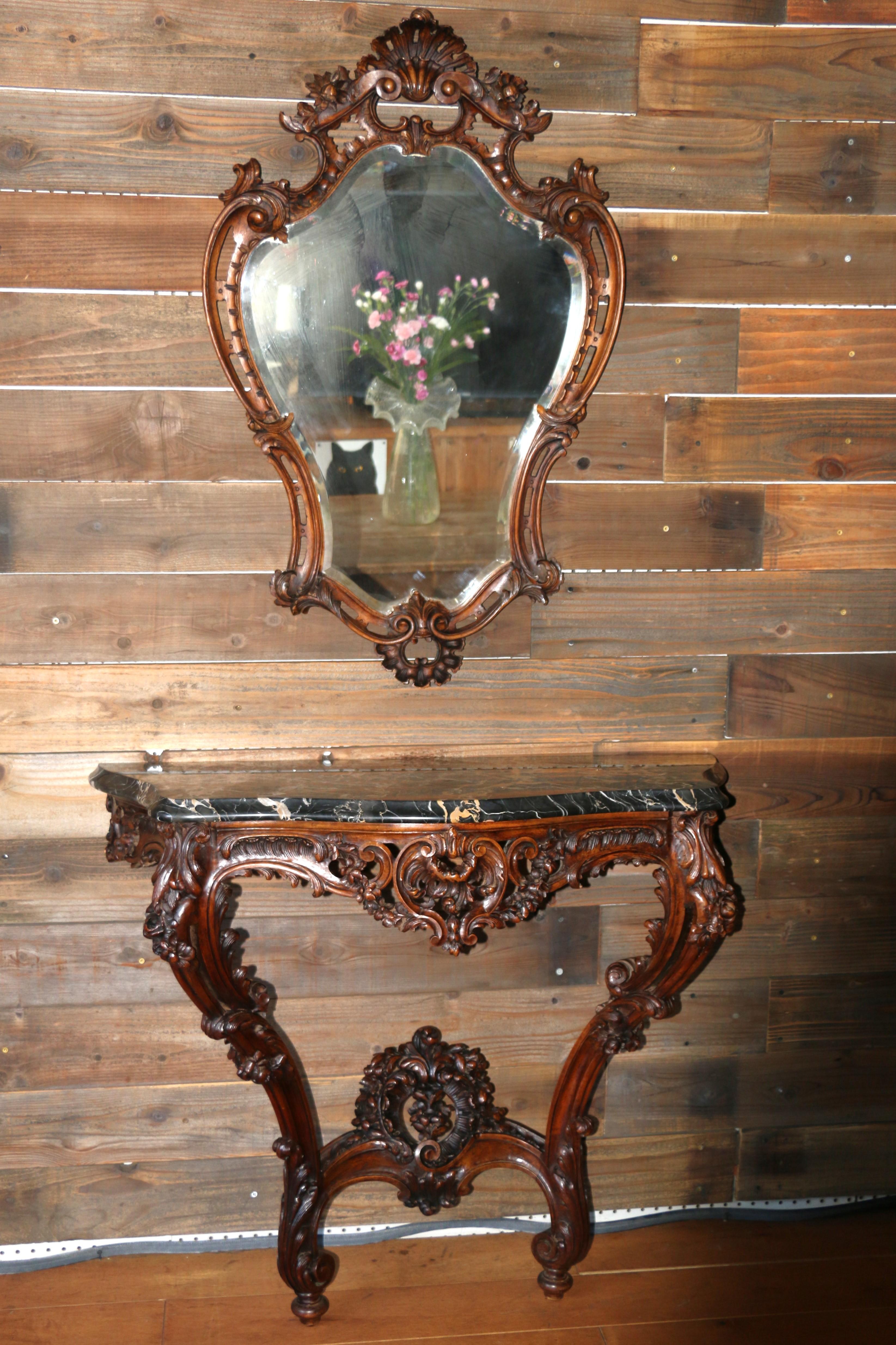Spectacular set mirror and console table made of solid wood and marble top. They absolutely are in good condition, no damages no broken or missing parts. Just an amazing art work hand carved wood.
Dimensions:
Table
41in L” x 17in D” x 35in