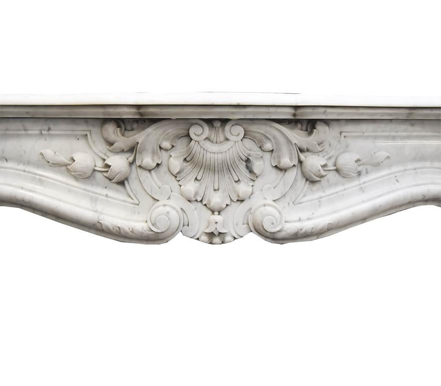 French Antique Louis XV marble firplace mantel from the 19th Century
