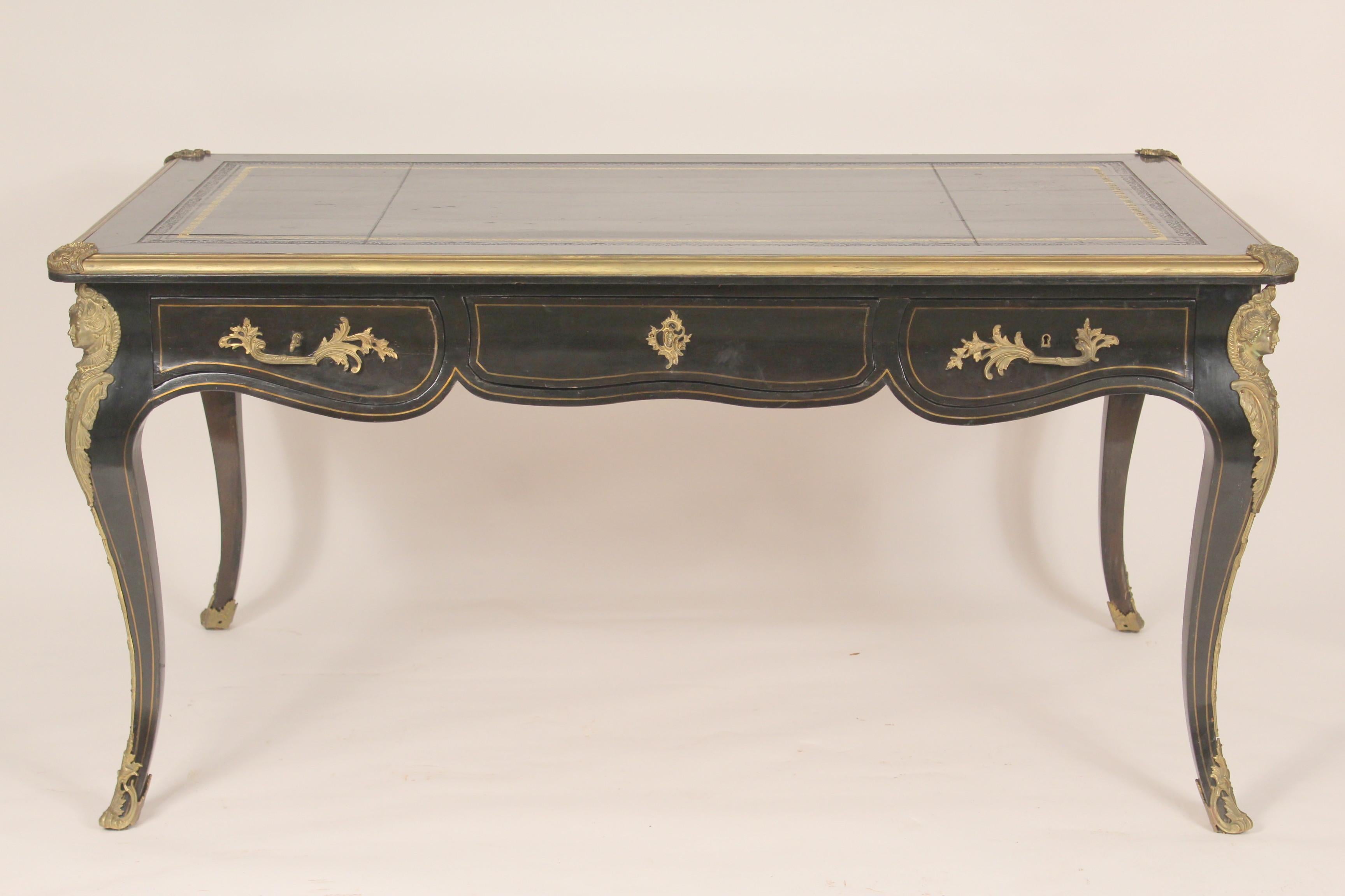 Antique Louis XV style bronze mounted black lacquer bureau plat, circa 1920's. With nice quality bronze mounts, brass inlay, leather top and hand dove tailed drawer construction. Formerly sold by Antonio's Antiques, San Francisco, California.