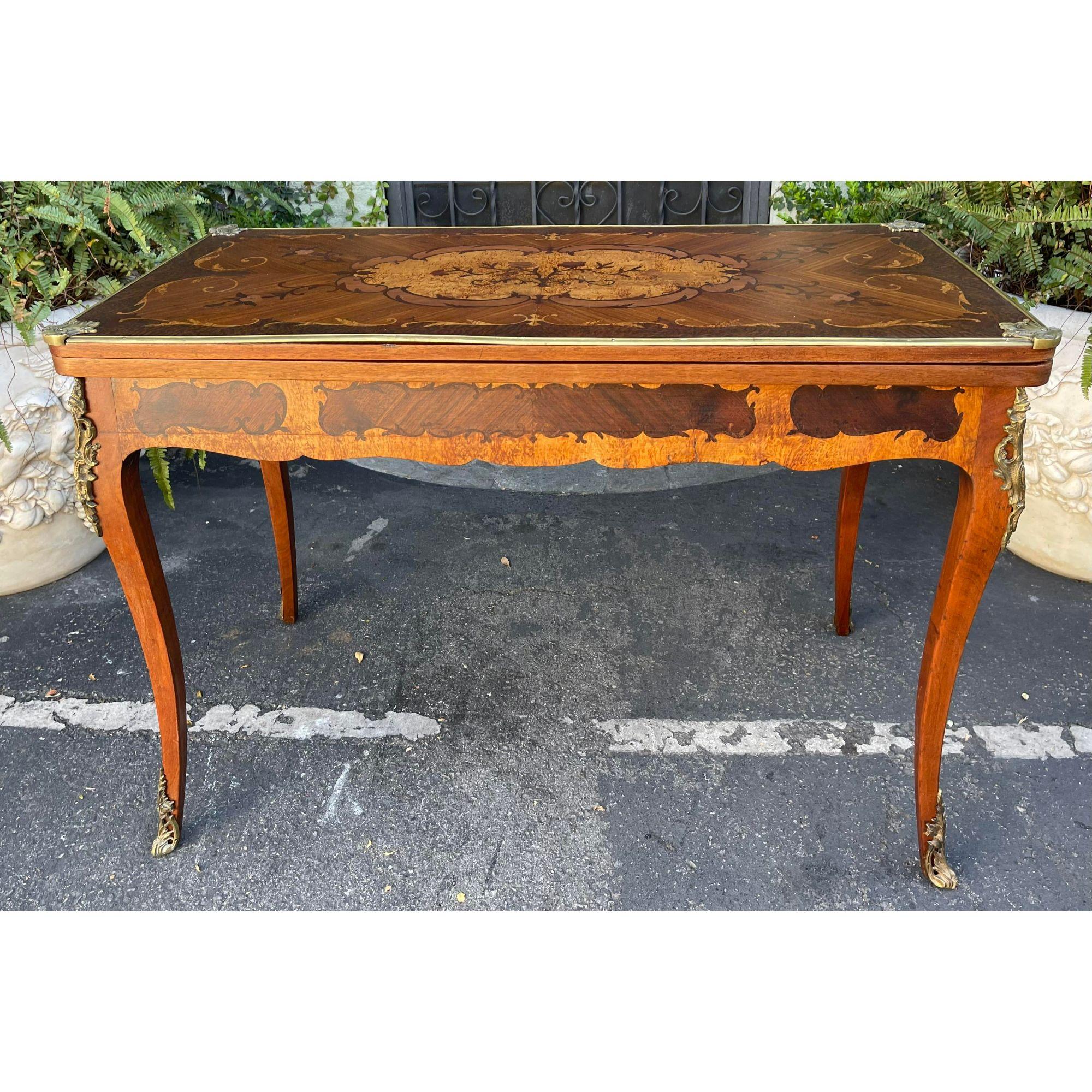 Antique Louis XV Style Bronze Mounted Marquetry Game Table

Additional information:
Materials: Bronze
Color: Bronze
Period: 19th Century
Styles: Louis XV
Table Shape: Rectangle
Item Type: Vintage, Antique or Pre-owned
Dimensions: 42