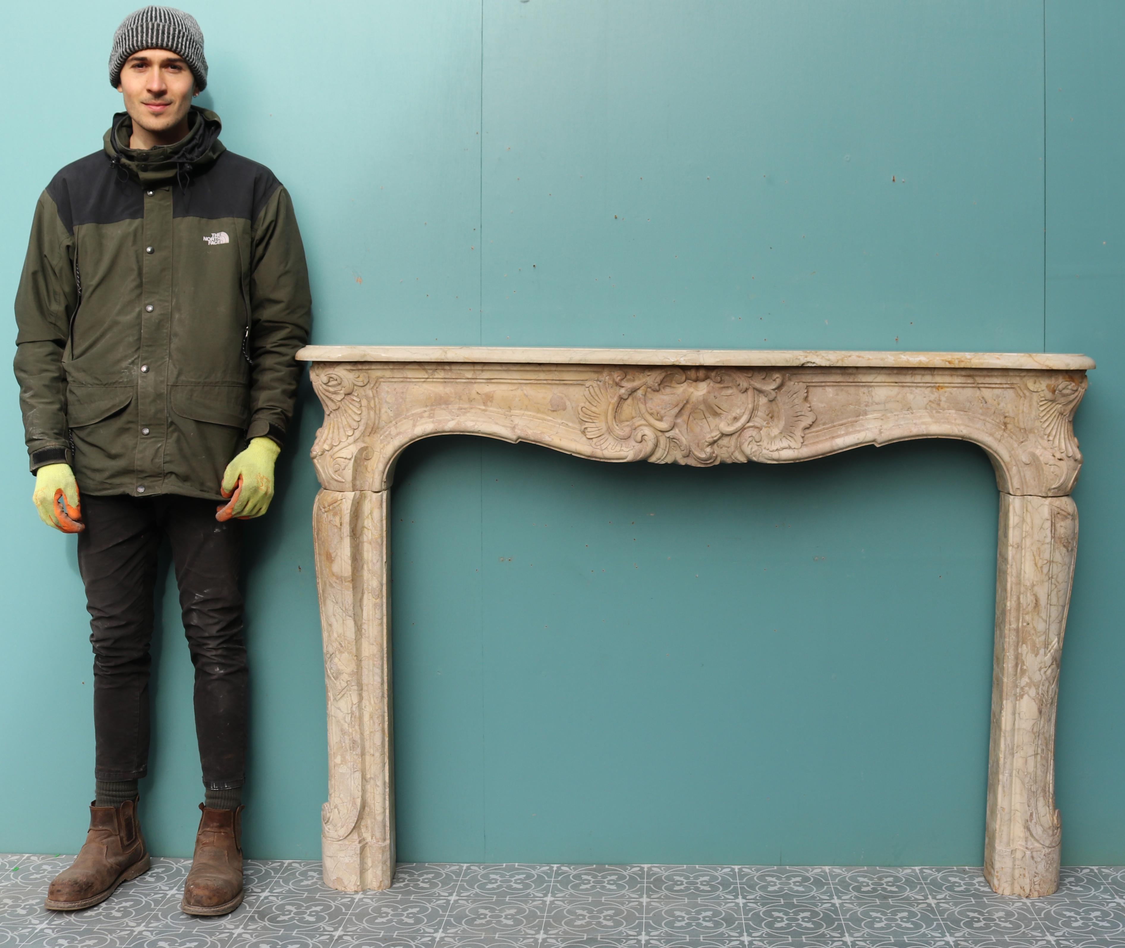 A French Louis XV style carved Sarrancolin marble fireplace, the frieze with centre shell, scrolls and foliage. Shaped serpentine shelf. This fireplace was removed from the Carlton Hotel, Cannes.

Additional dimensions:

Opening height 91