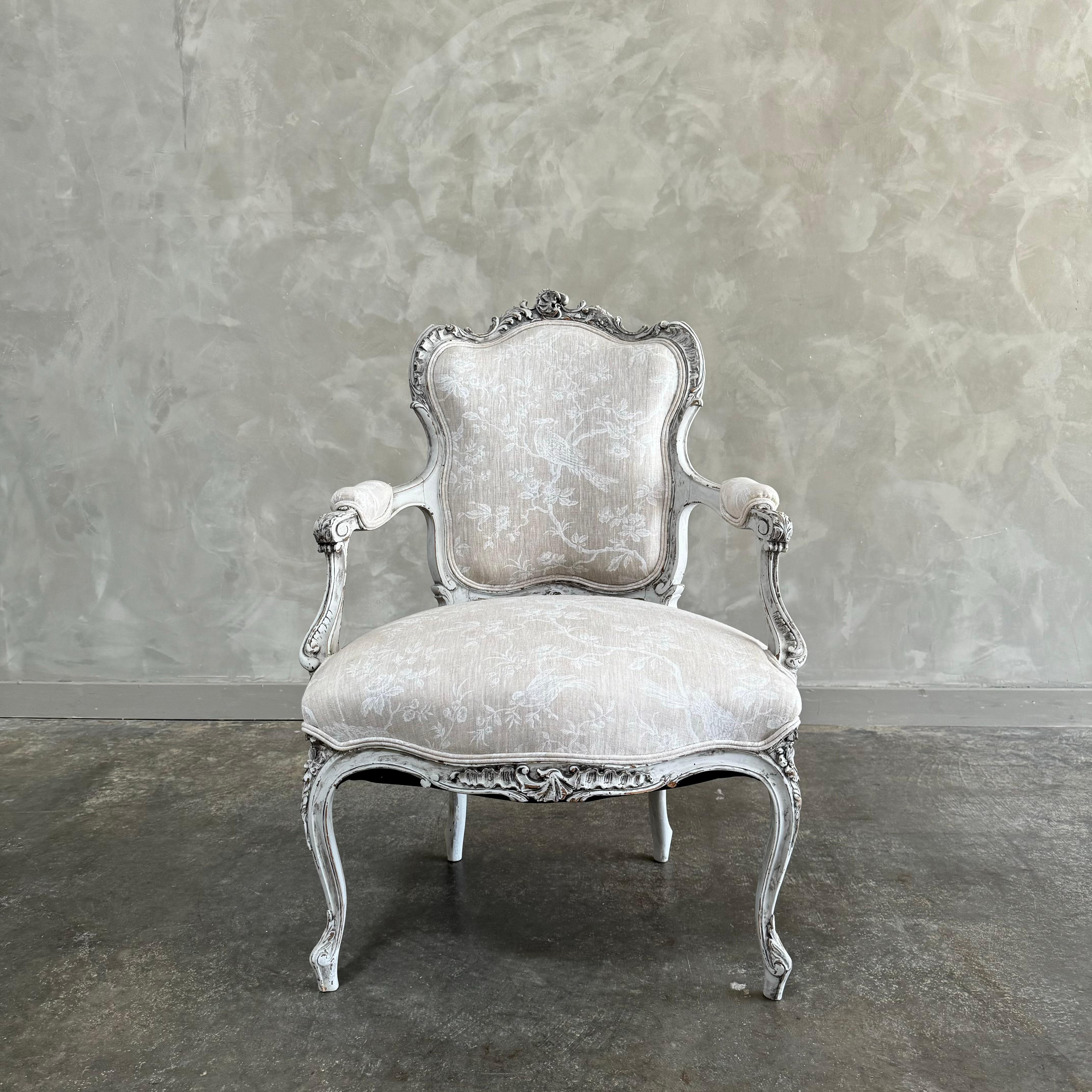 Antique French Louis XV Style chair. painted in a french oyster grey with subtle distress edges, finished with an antique glazed patina. Upholstered seat and back in a beautiful printed linen, solid and sturdy ready for everyday use. 
Dimensions: