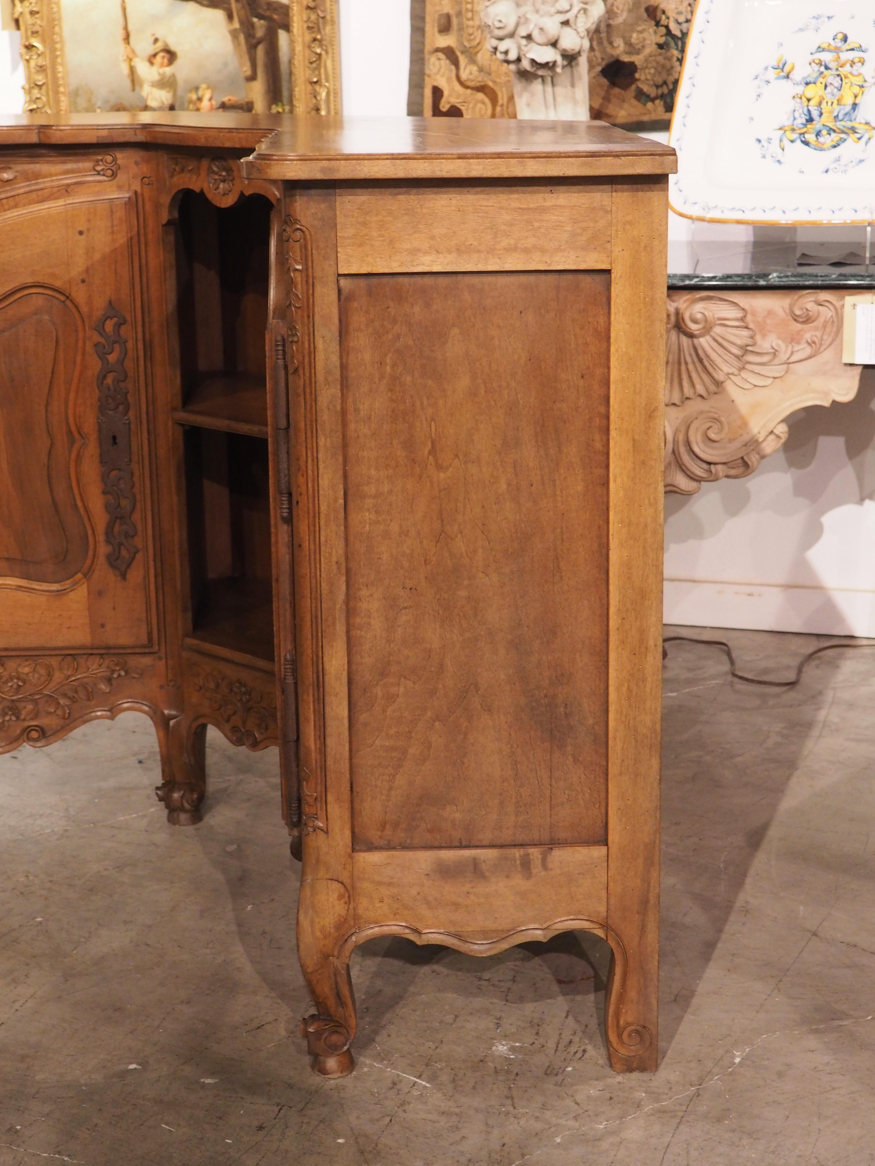 Known as an encoignure in France (literally “corner”), this corner buffet was hand-carved in Provence, circa 1900. First seen during the reign of Louis XV, encoignures were light, full of movement, and highly practical. The top, which has a thin