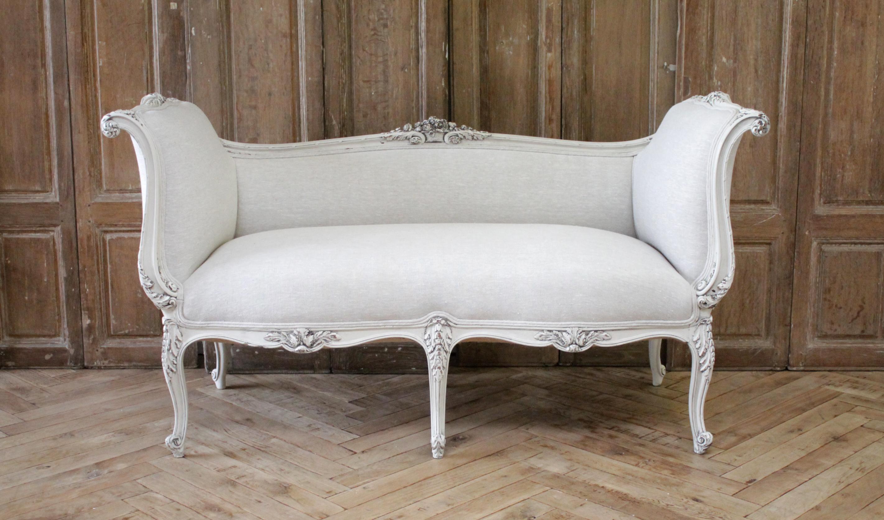 Antique Louis XV style French carved and upholstered settee bench
Painted in our oyster white finish, which is an off white with subtle distressing, and antique patina that has a grey hue.
A large carved basket of flowers with scrolled acanthus