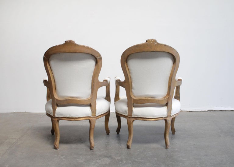 Pair of Louis XV style armchairs in carved wood, seat ga…