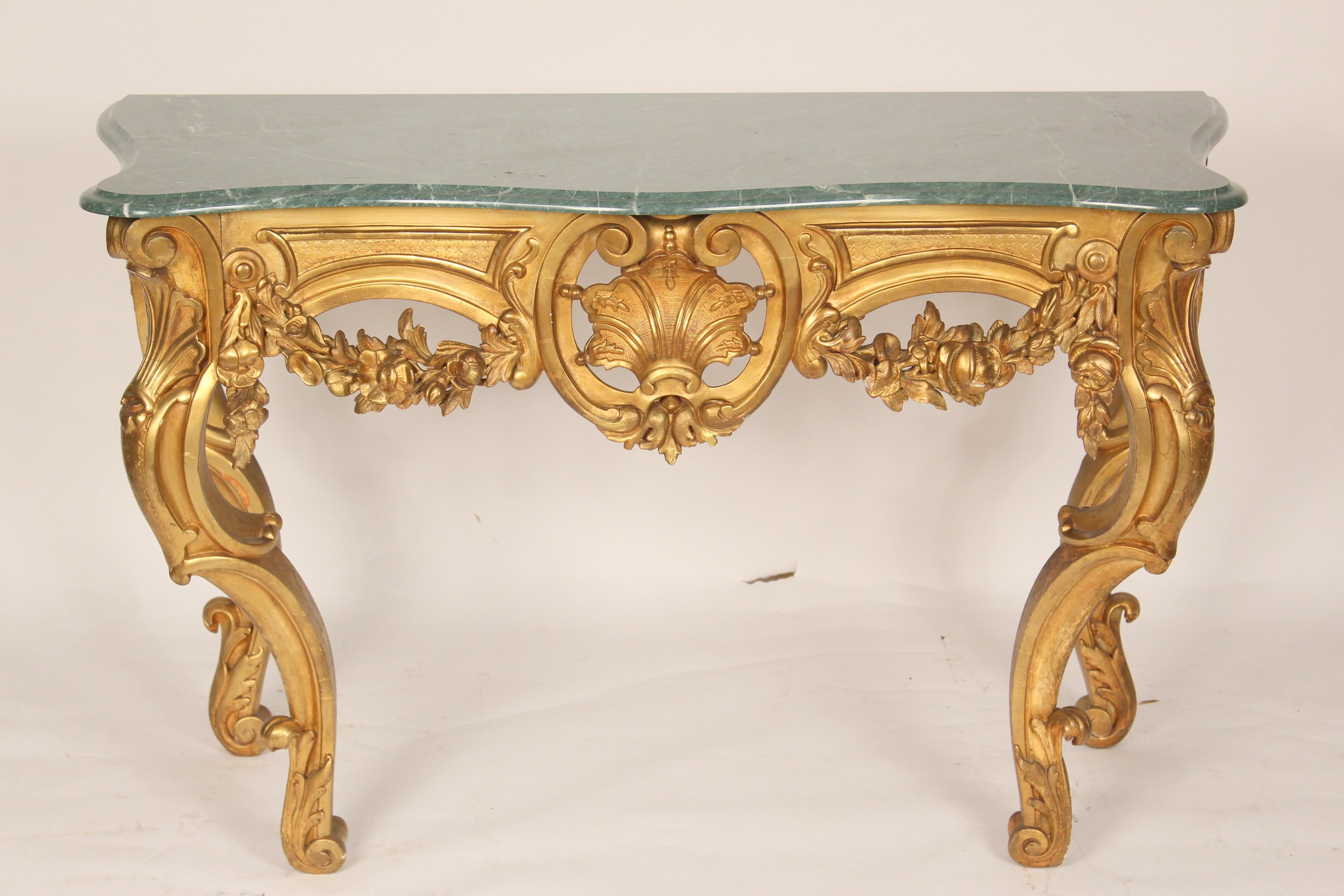 Antique Louis XV style gilt wood console table with a marble top, late 19th century. The marble top is late 20th century.