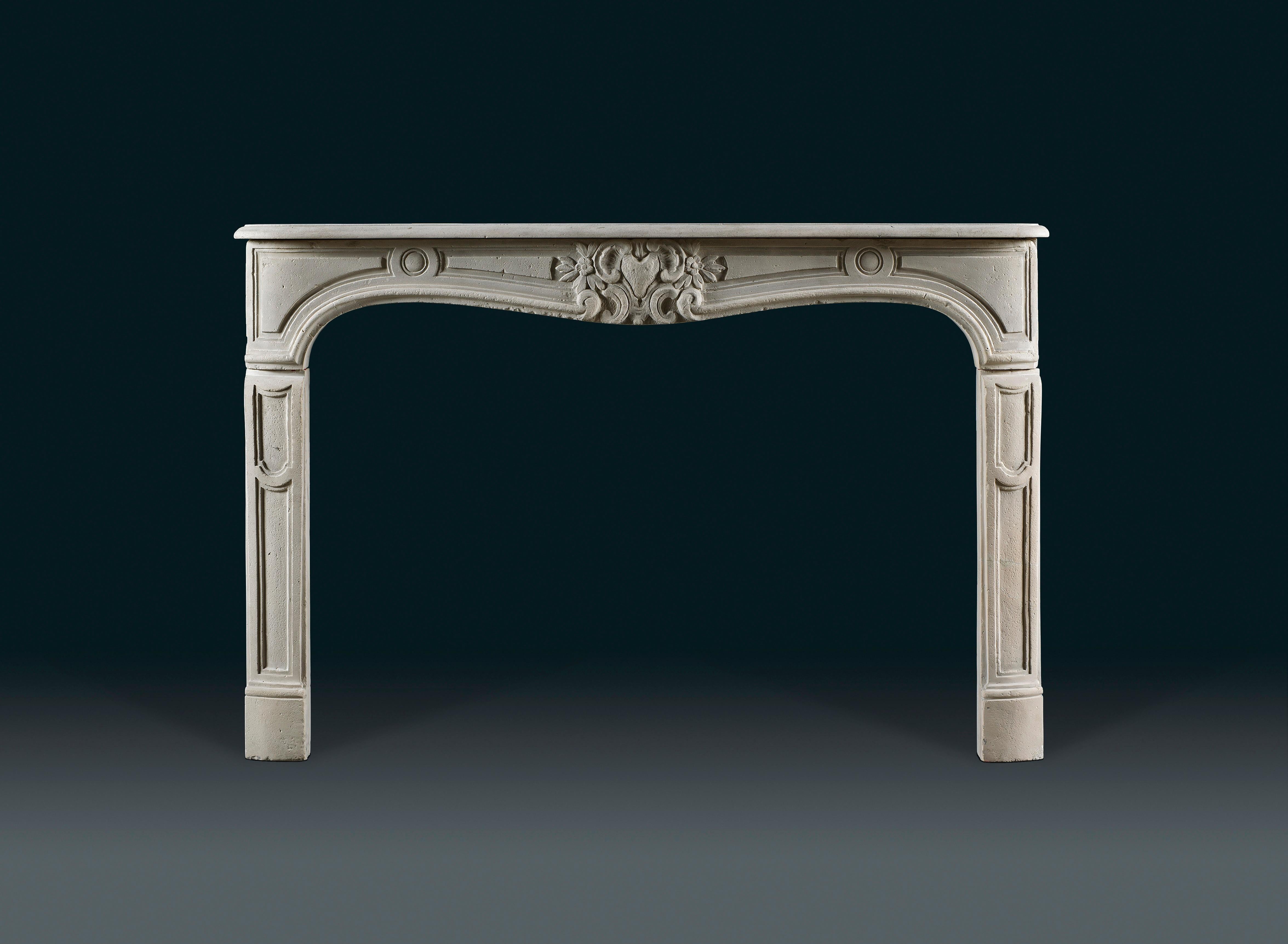 With serpentine shelf and frieze, which is centred with a foxes’ head surrounded by “C” scrolls and flowering foliage, flanked by cartouches and circular paterae, 19th century.