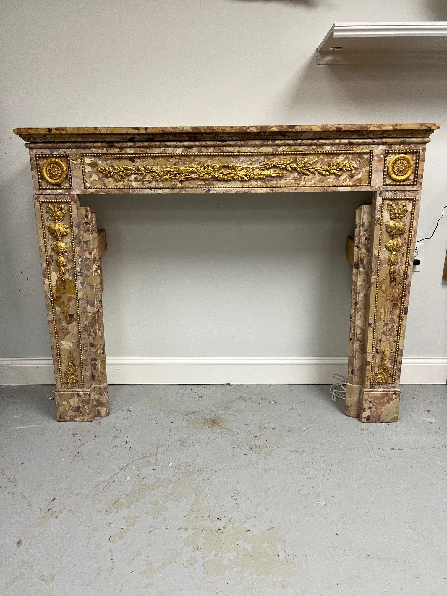 Fabulous Louis XVI antique fireplace mantel in Breche d'Alep marble with beautiful bronze ormolu enrichments. A deep and generous mantel above with beautiful designs in the marble make this a very good looking fireplace mantel with a rich and