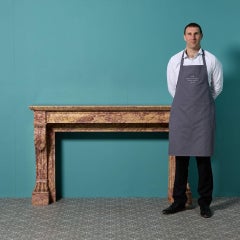 Cheminée ancienne Louis XVI en marbre Brocatelle