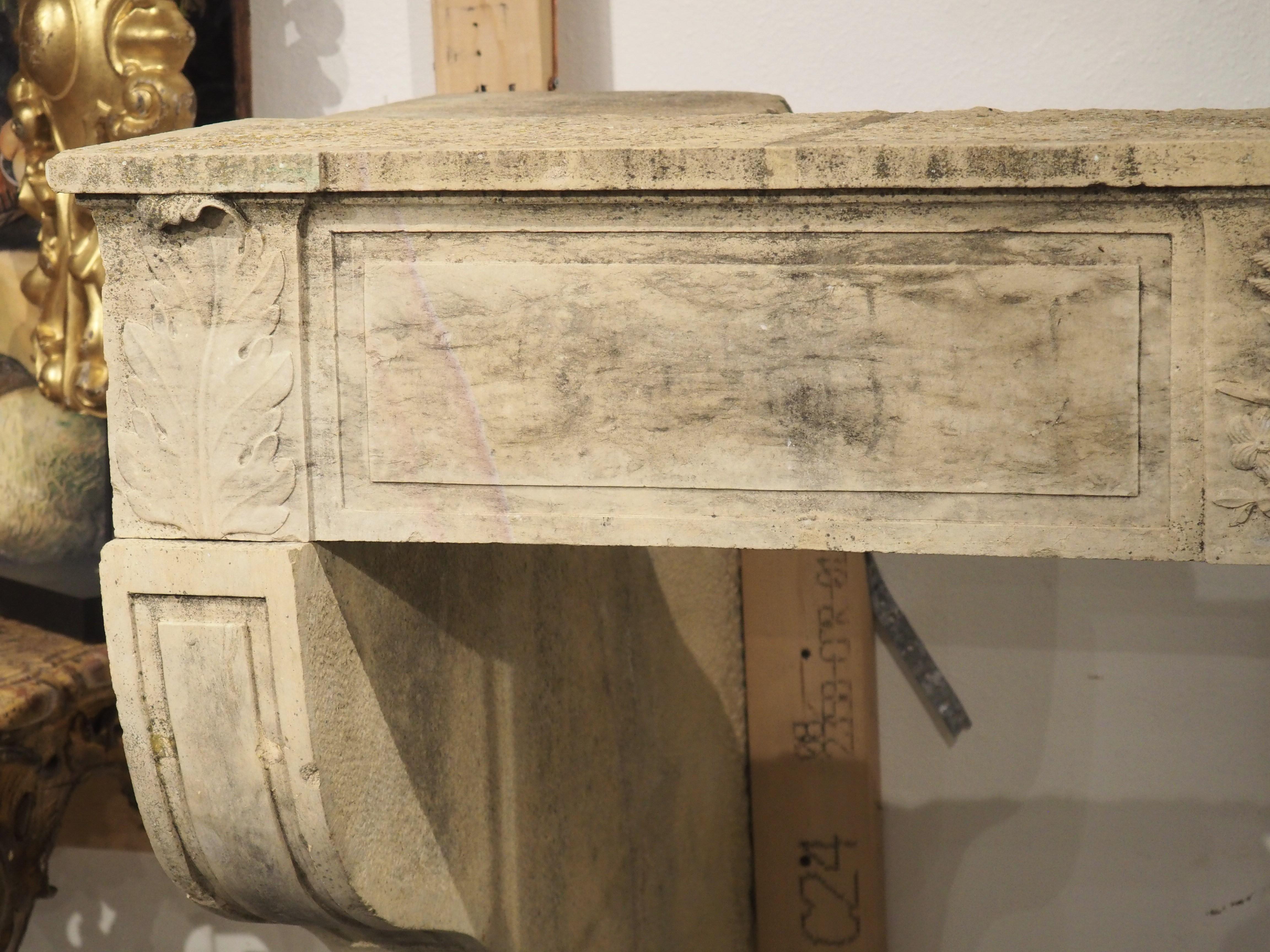 Hand-Carved Antique Louis XVI Limestone Fireplace Mantel from Beaune, France, Circa 1785 For Sale