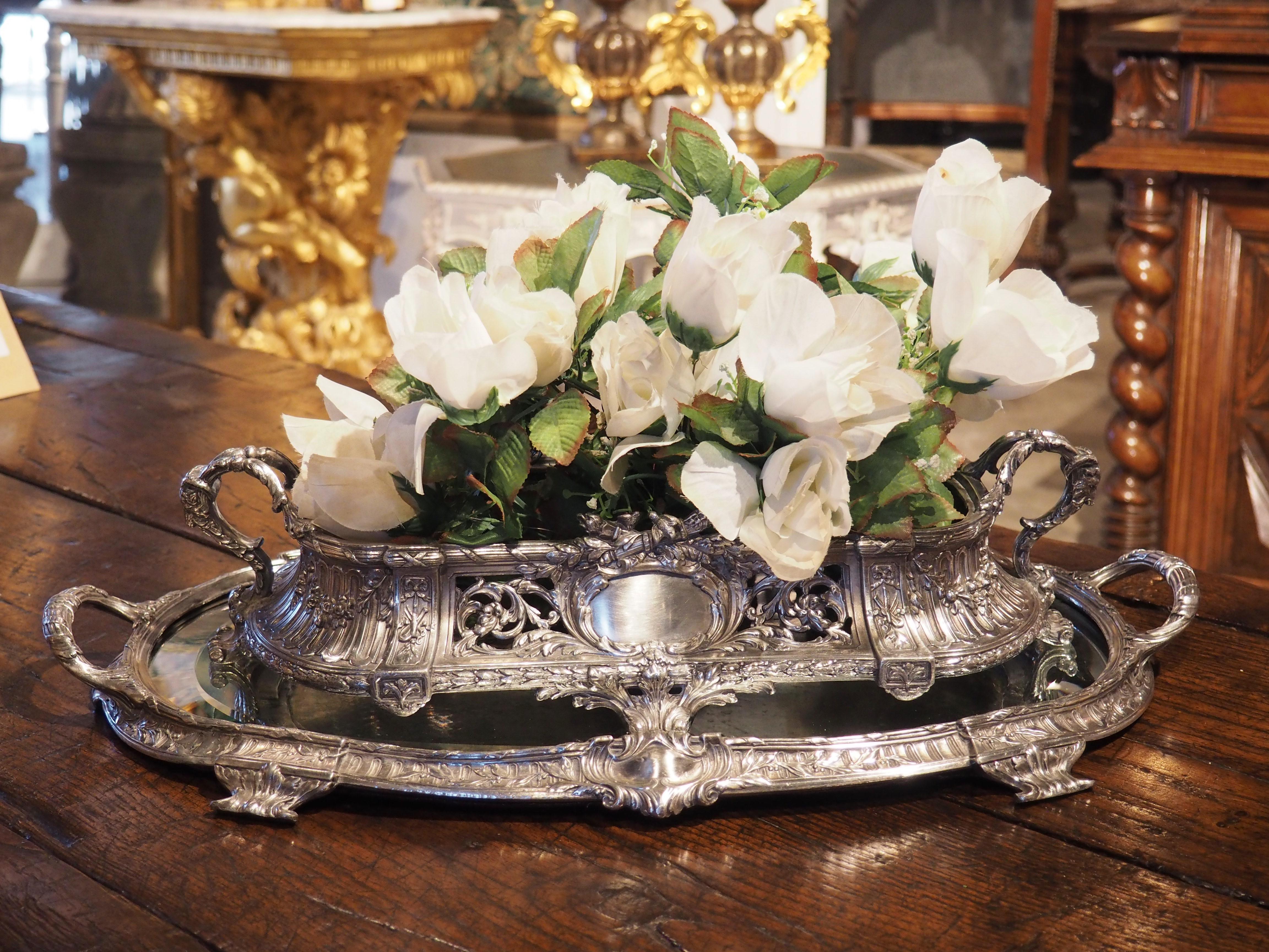 In France, a mirrored plateau that is displayed on a table is known as a surtout de table. The mirrors ranged in size from a foot long to well over 20 feet; other materials varied as well, although gilding, silvering, and exotic metals were quite