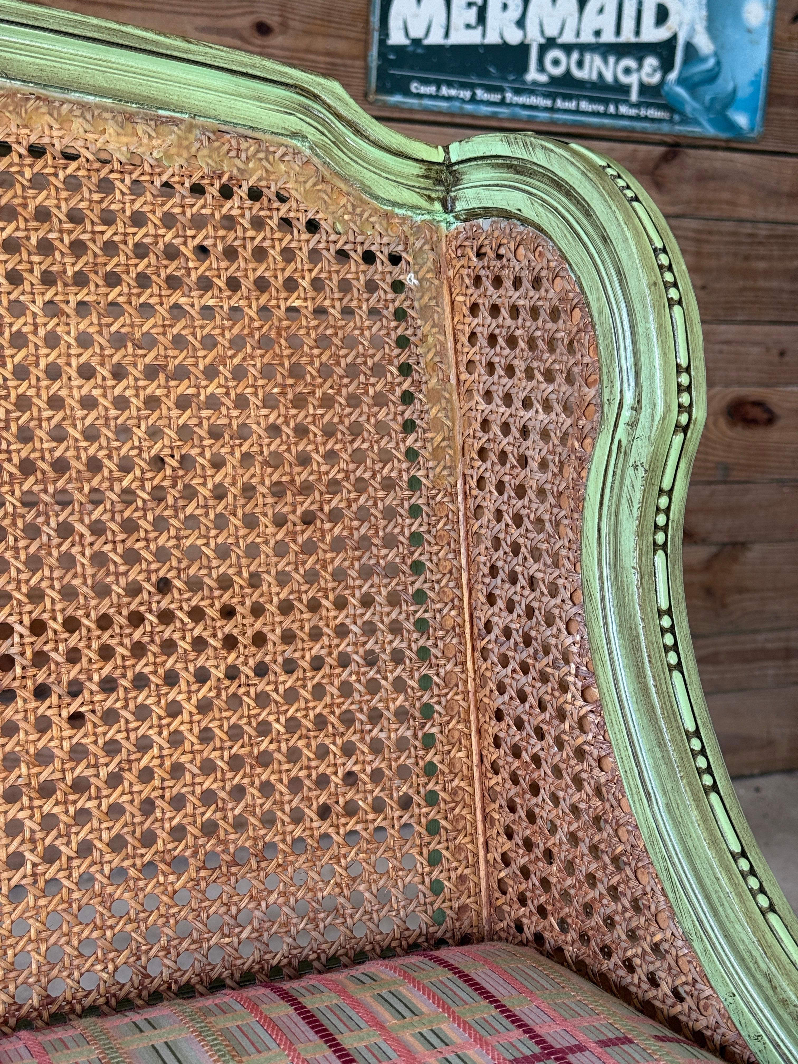 Wood Antique Louis XVI Style Caned Settee With Distressed Green Painted Finish For Sale
