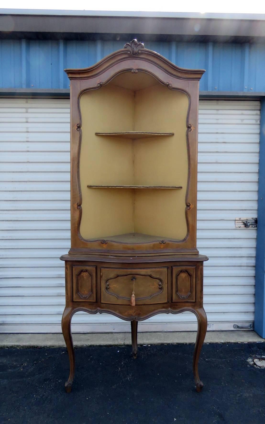 Antique Louis XVI style corner étagère with two shelves over one drawer.