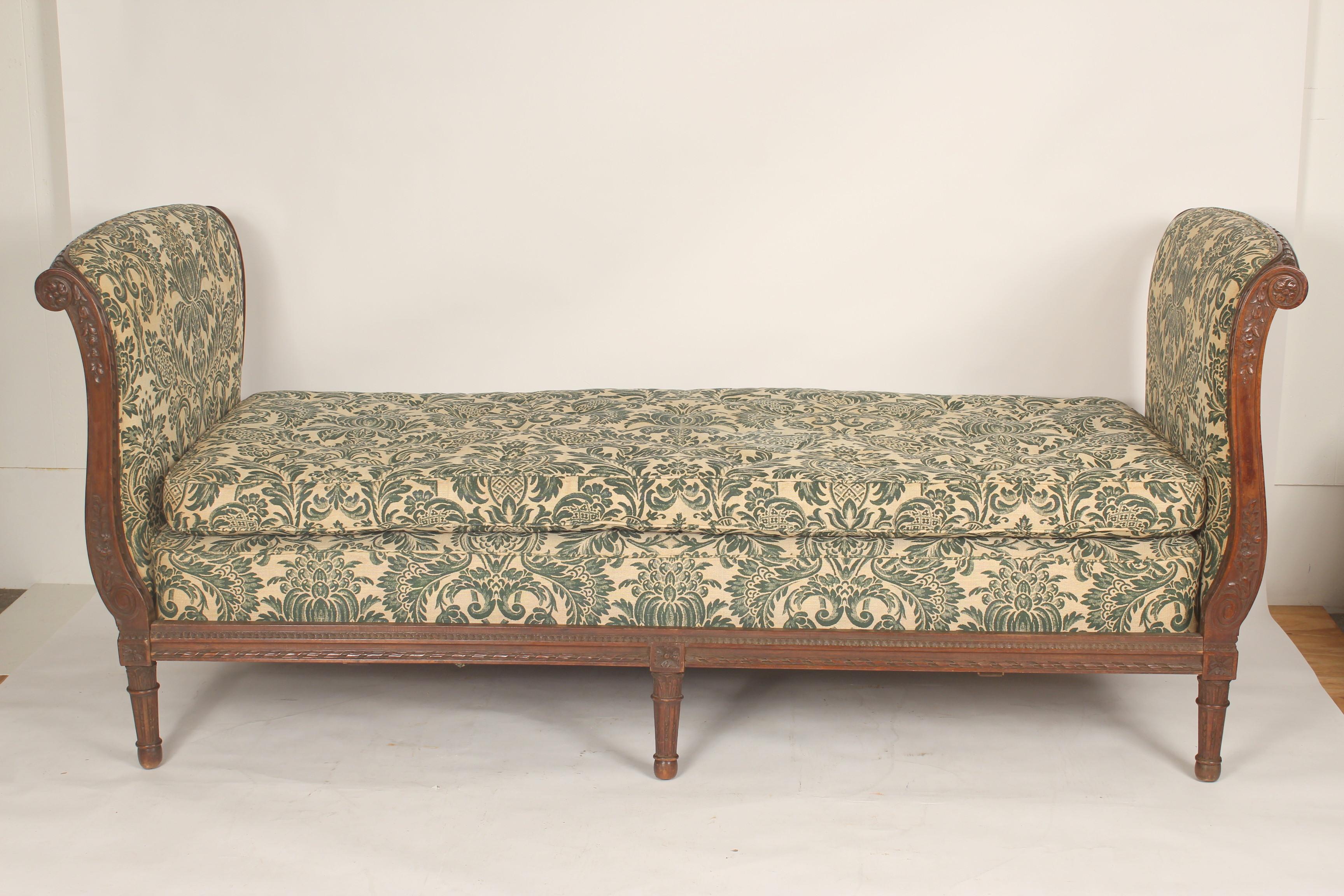 Antique Louis XVI style carved oak daybed, 19th century. Nicely carved oak frame, good patina to the oak bed frame and vintage upholstery. I believe the stuffing in the mattress is straw. The mattress size is 32