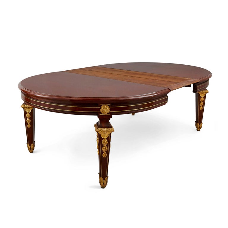 Antique Louis XVI style dining table by Mercier Frères
French, late 19th century
Dimensions: Height 73cm, width closed 168cm, width open 330cm, depth 139cm

This beautiful neoclassical style dining table is crafted from mahogany, satinwood, and