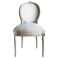Antique Louis XVI Style French cane back chair in Oyster White Finish