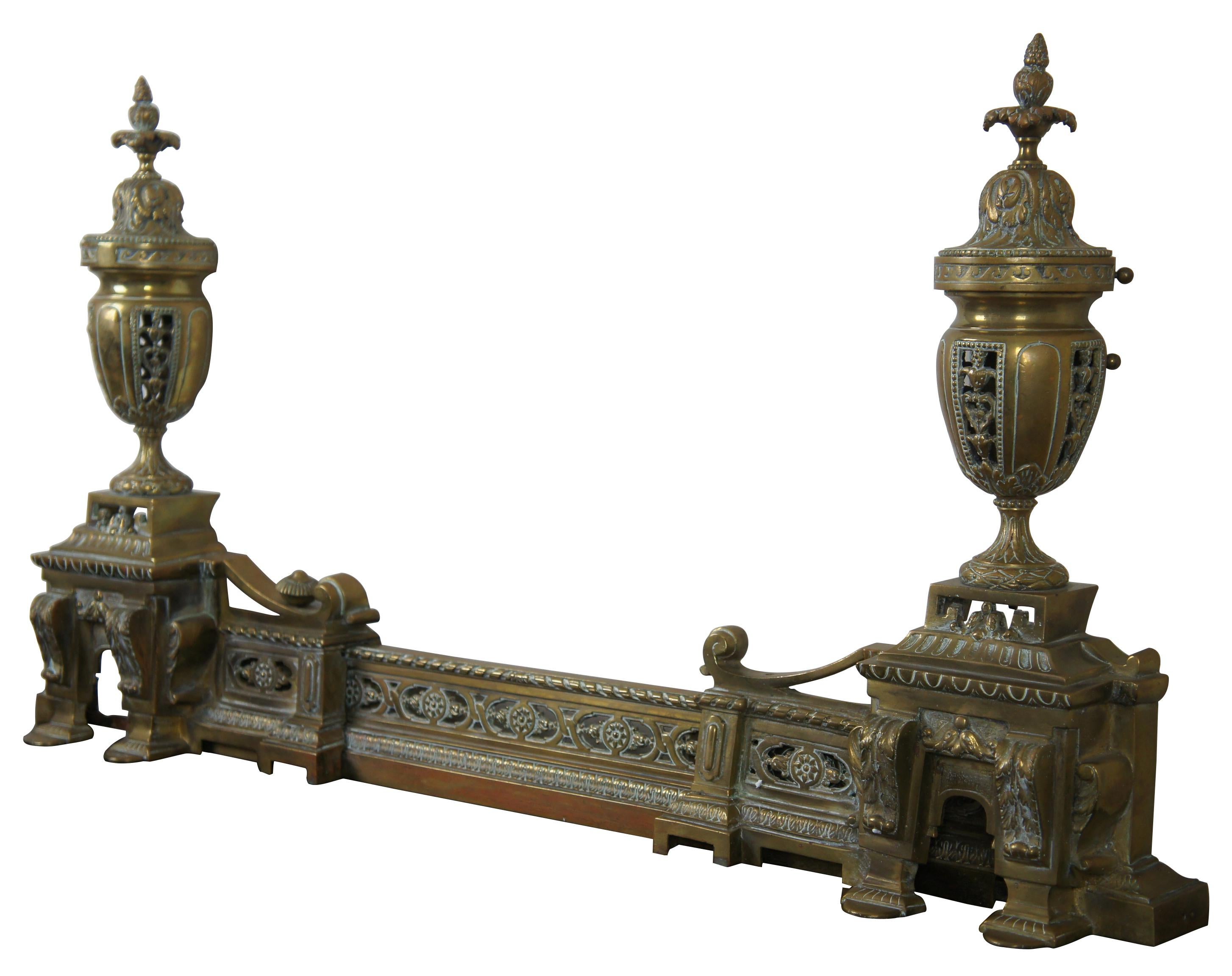 Antique Louis XVI style French gilt bronze chenets and fender andiron adjustable

Napoleon III French adjustable fireplace fender and andirions. Beautiful details with large trophy urns mounted along the andirons, acanthus engravings, trophy