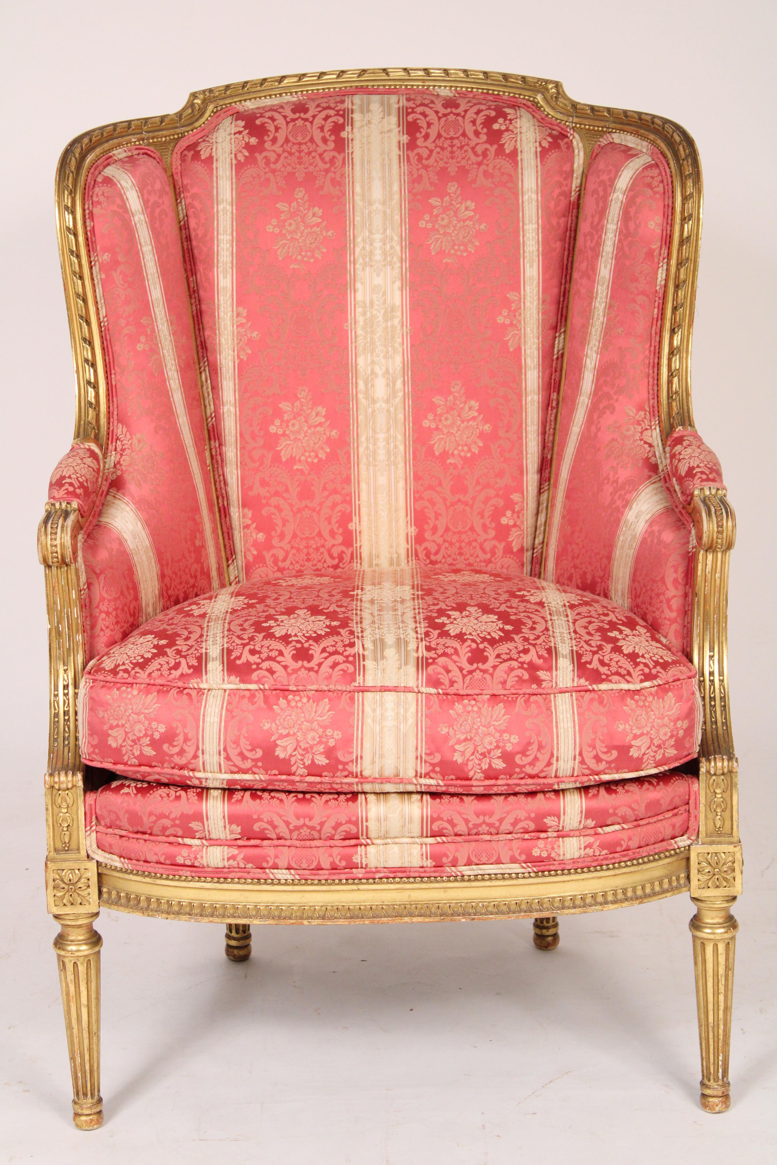 Antique Louis XVI style gilt wood (gold leaf) bergere, circa 1900. With a down filled seat.