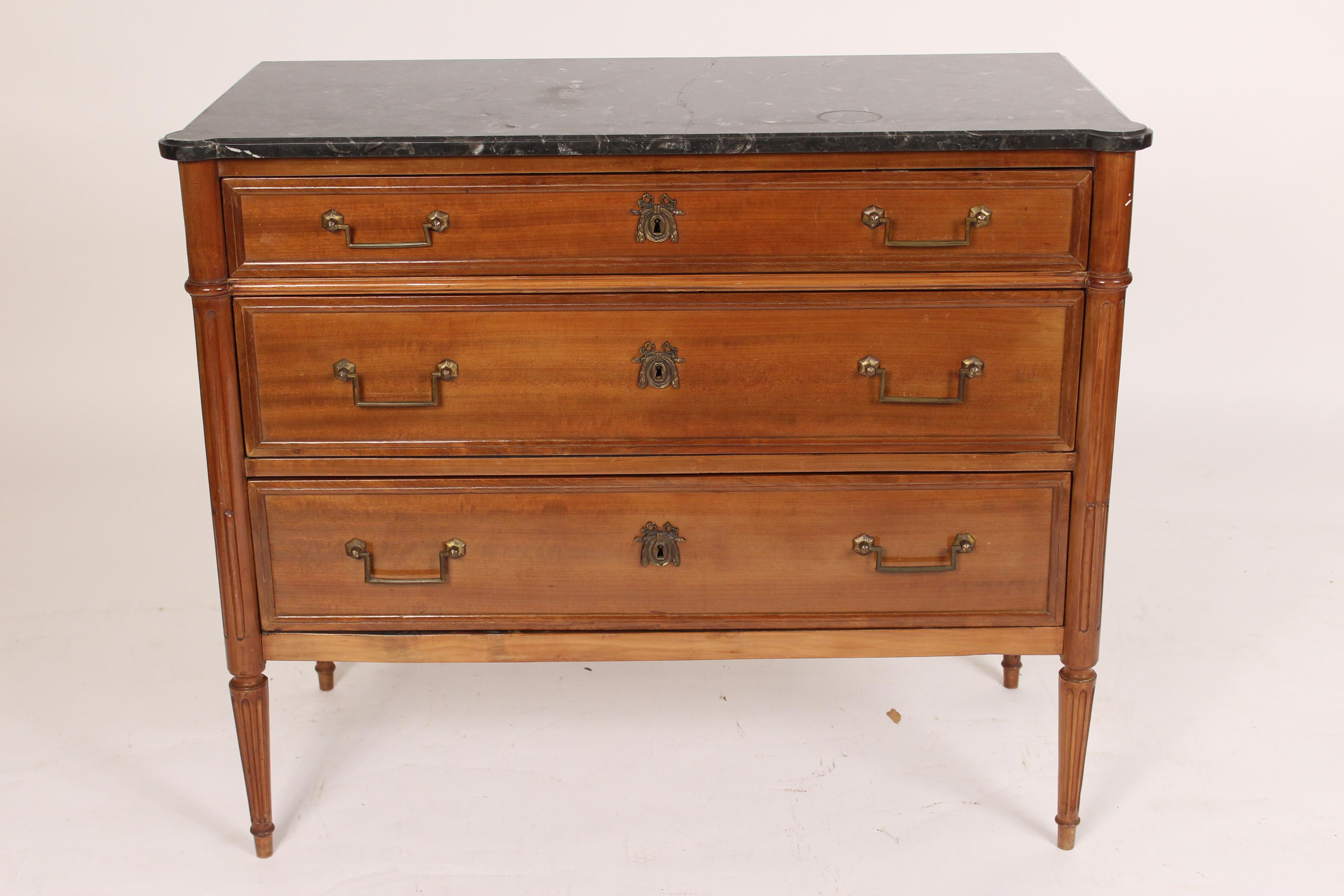 Antique Louis XVI style mahogany chest of drawers with a marble top, circa late 19th century.