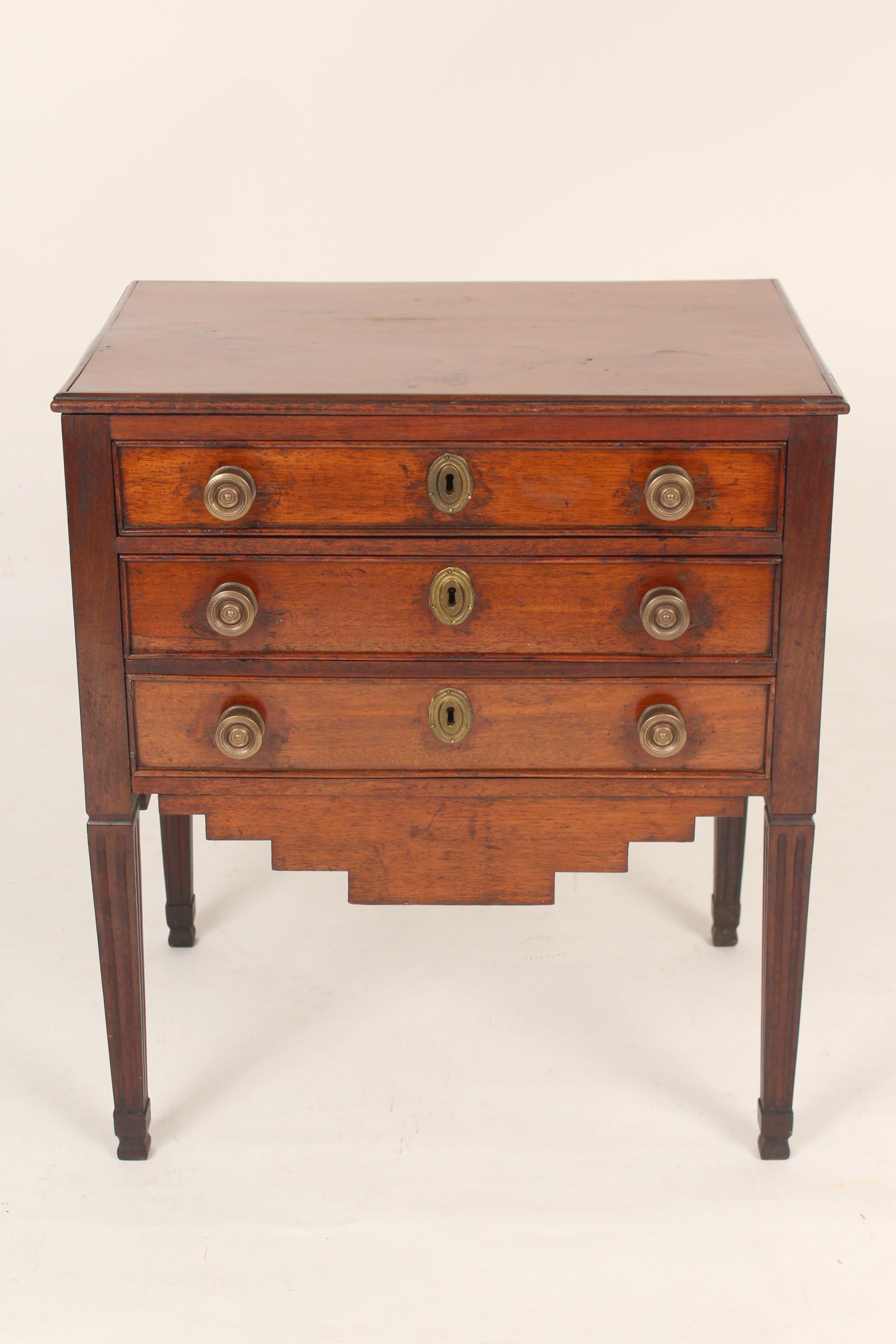 Antique Louis XVI style mahogany occasional commode, 19th century. With nice antique patina, square tapered fluted legs, hand dove tailed drawer construction and the back is finished.