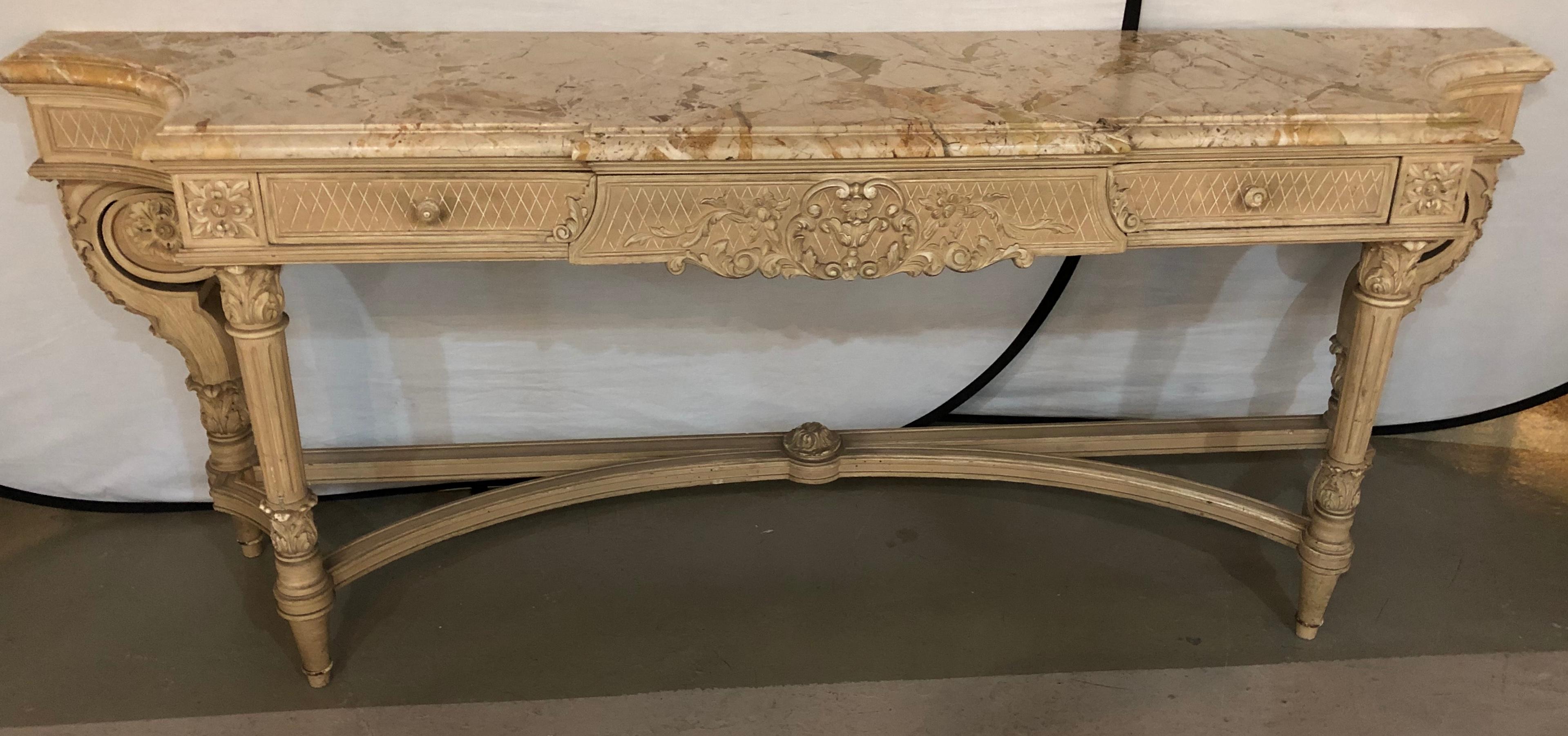 Antique Louis XVI Style Maison Jansen marble-top sideboard or console table. This large and impressive original paint decorated sideboard or console table is seen in the Maison Jansen archives. The off white cream distressed finish indicative of the