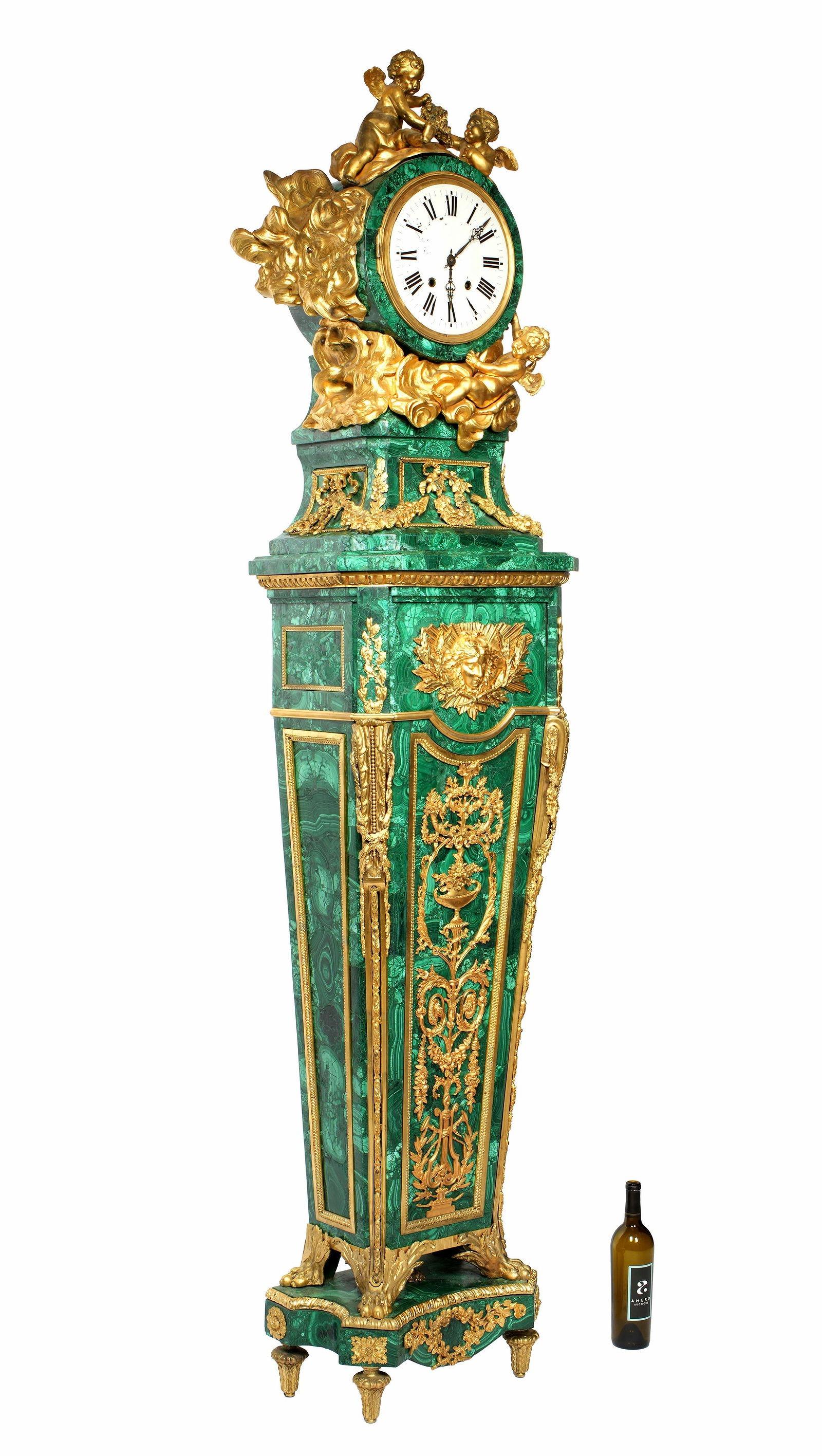 Magnificent antique (mid to late 19th century) tallcase grandfather clock after the original French Louis XVI period design by Jean-Henri Riesener (1734-1806), with finely cast ormolu gilt bronze mounts and malachite veneer.  88 3/4 by 21 by 14