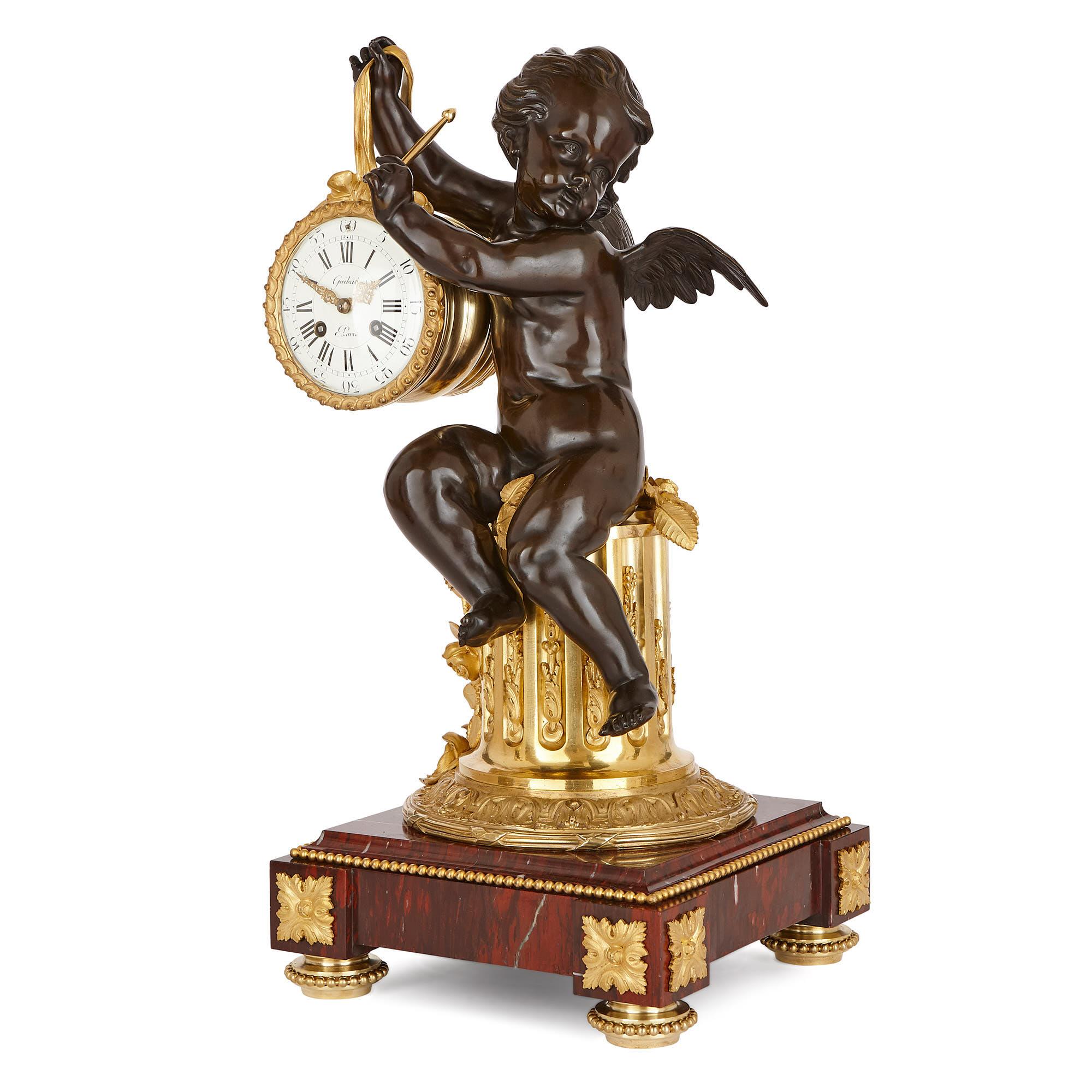 This clock set is a remarkable antique, which is not only a brilliant piece of technical design—serving as a fully-functioning timepiece—but is also an exceptional work of sculpture. 

The set is comprised of a mantel clock and a pair of flanking