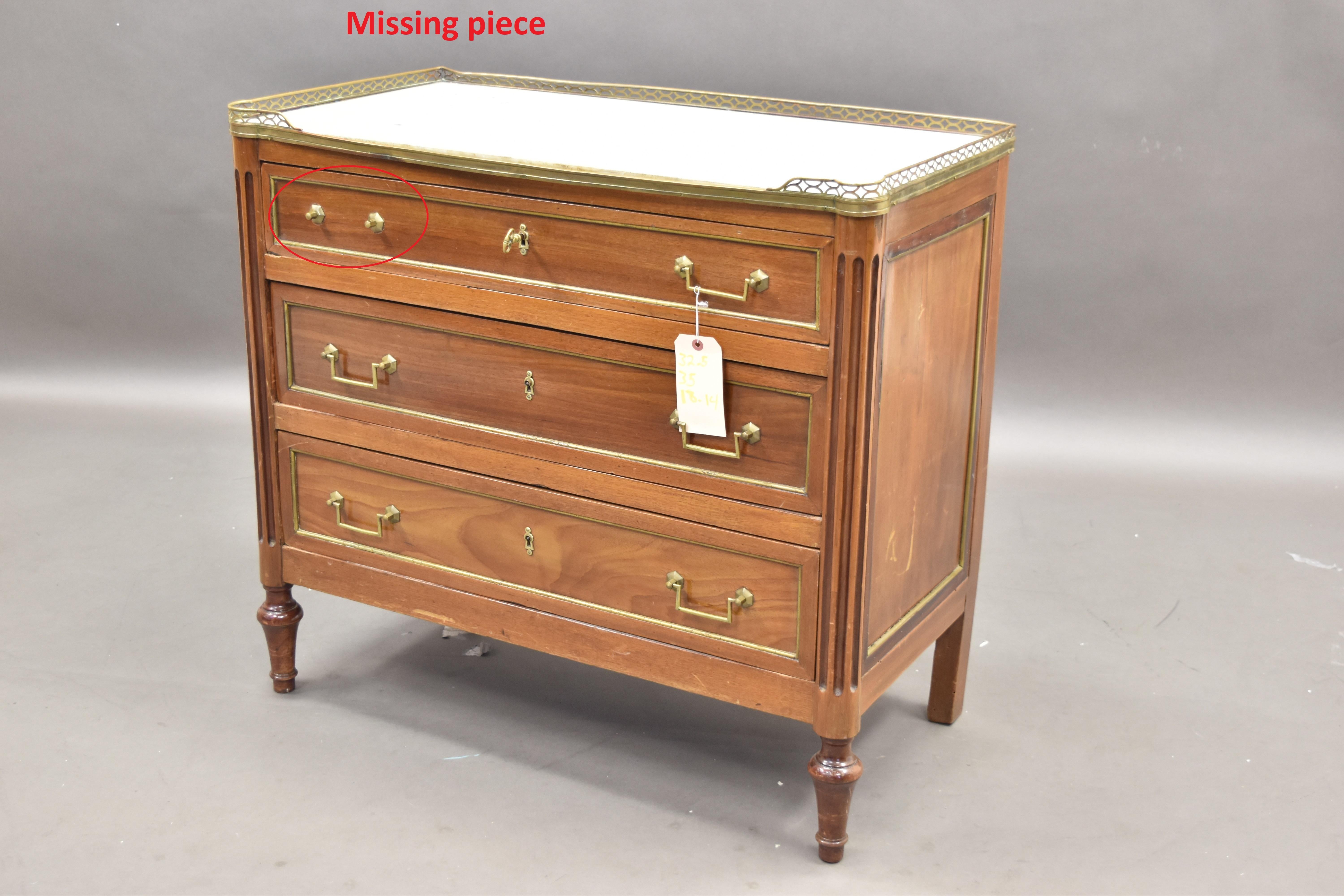 Incredible Louis XVI-style Chest in beautiful, solid Mahogany. This extraordinary piece features a marble top with a finely detailed open weave brass surround. The chest features (3) drawers with brass u-shaped hardware pulls and hexagonal