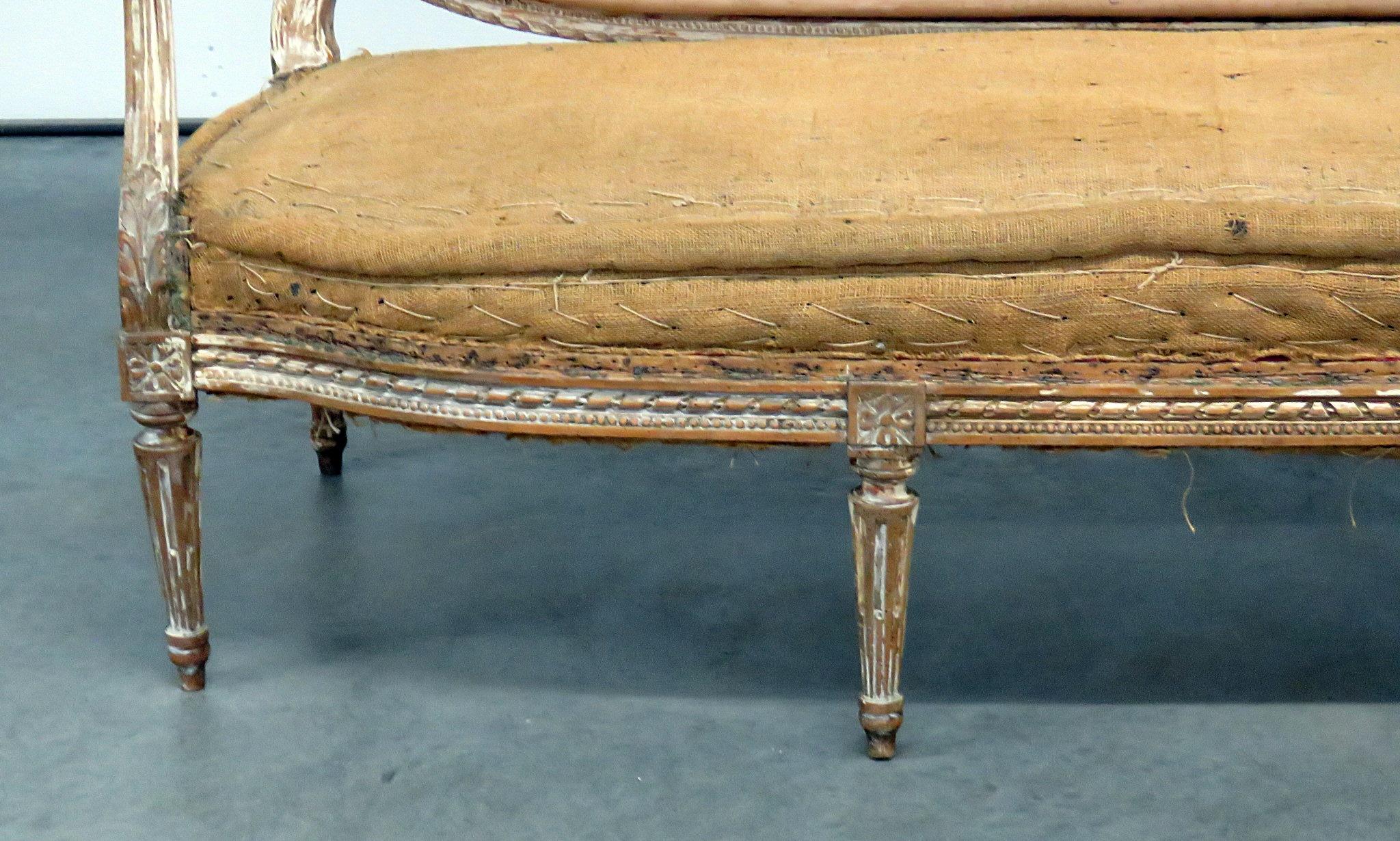 Antique Louis XVI style distressed painted sofa.