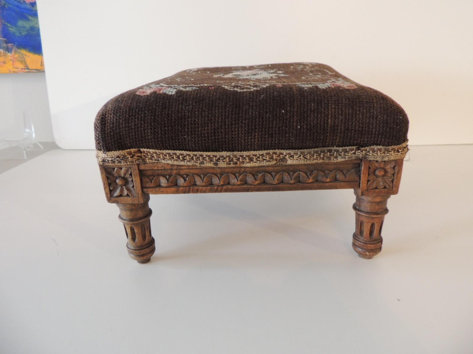 Antique Louis XVI style tapestry upholstered footstool.
Brown and pink tapestry covered and small gimp trim on wood frame.
Size: 10