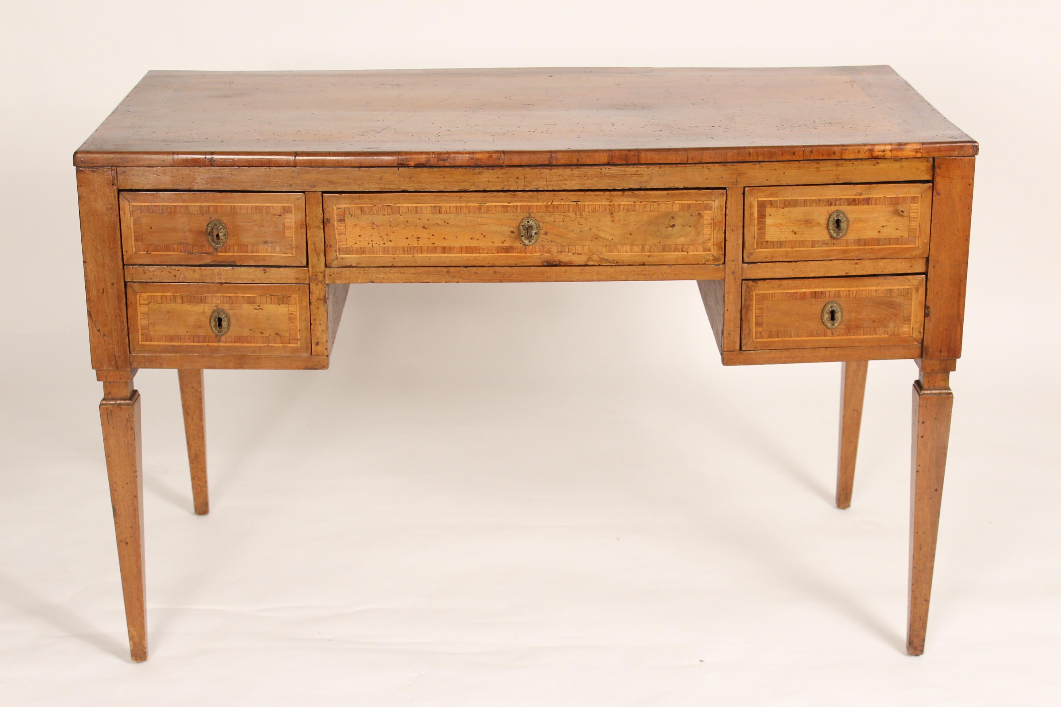 Antique Louis XVI style walnut desk, 19th century. With hand dove tailed drawer construction and excellent old walnut color. Stamped on bottom 