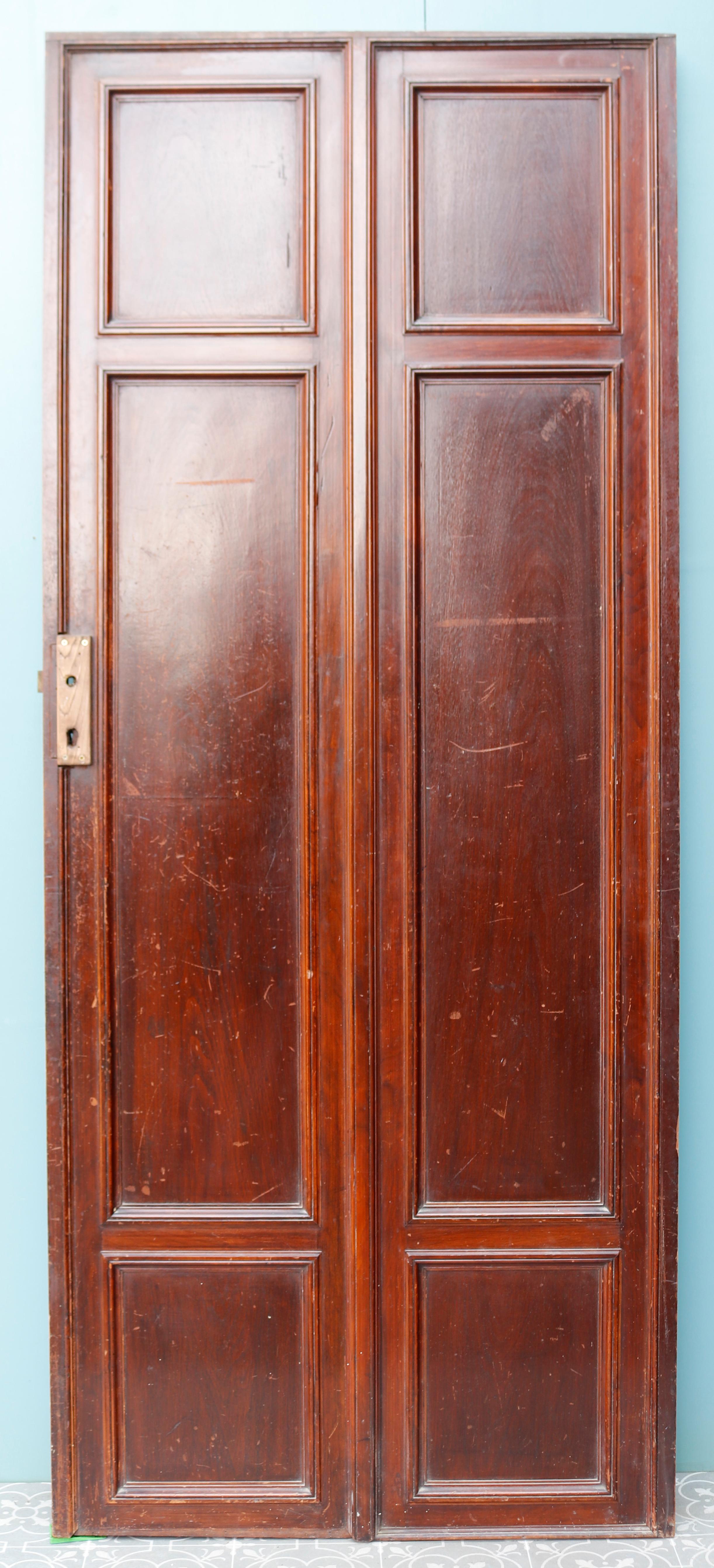 Antique carved walnut door. This French, early 20th century door includes carved leaf patterns in a grand design on all six panels. A very decorative interior door in Louis XVI style. If you need help choosing your antique door, please take a look