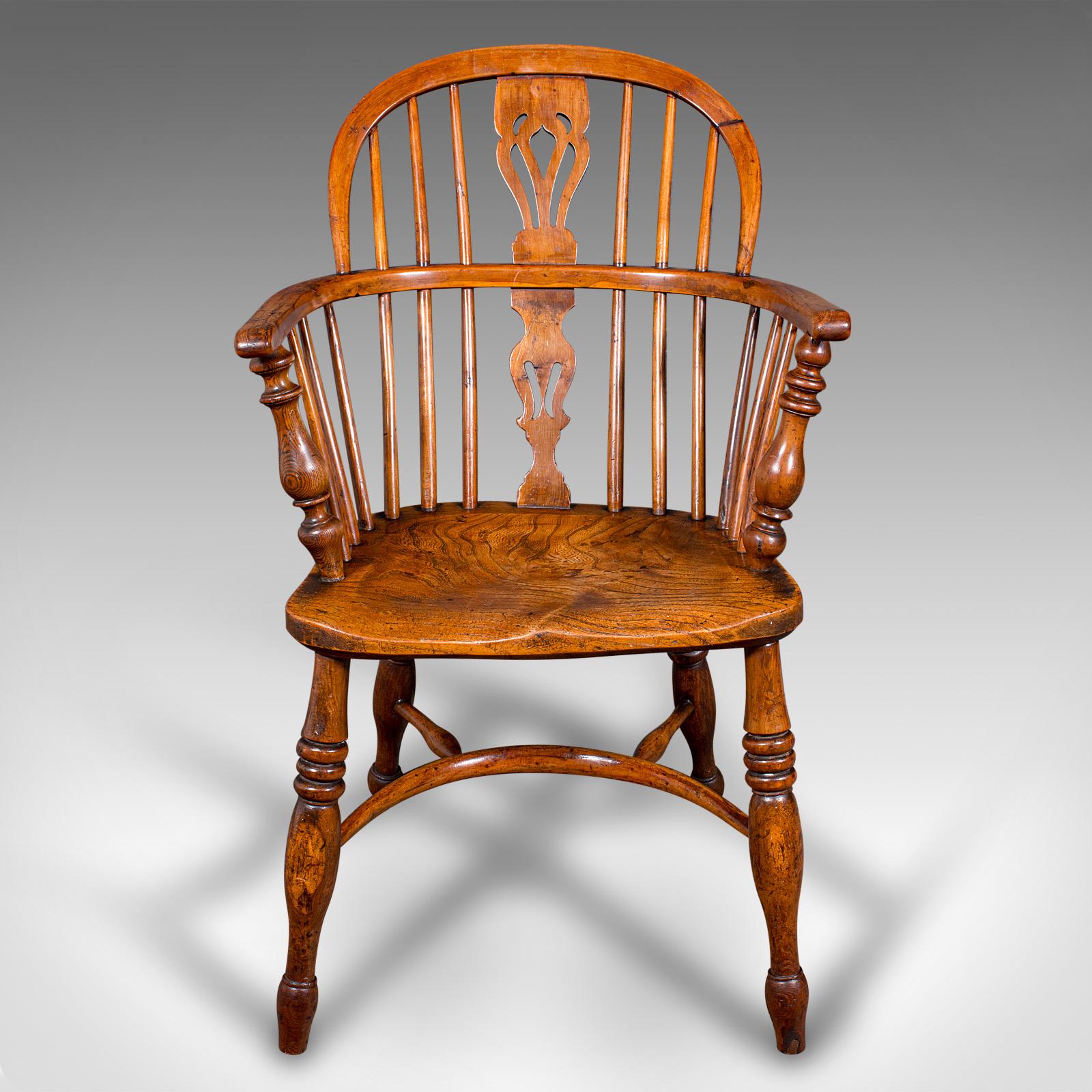 
This is an antique low back Windsor chair. An English, elm and yew elbow or armchair, dating to the Victorian period, circa 1850.

Superb country house appeal, in the attractive Windsor form
Displays a desirable aged patina and in good order
Elm