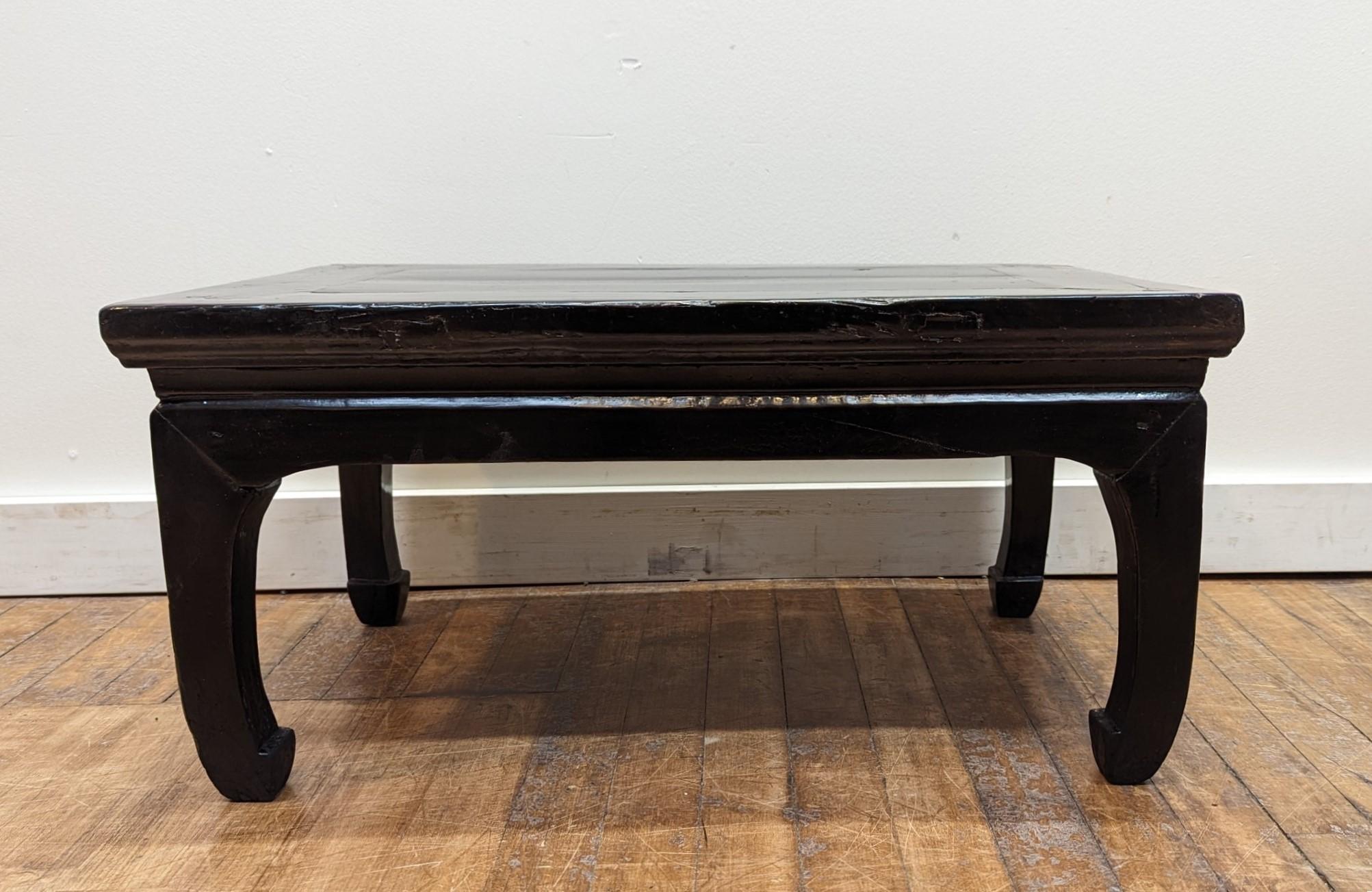 Antique Low Cocktail Table..  A classically styled and composed Chinese antique low table of Qing Dynasty.  Hardwood waisted table with turned in legs of horse hoof feet.   A waisted table is one where the top sits raised above a waist set on the