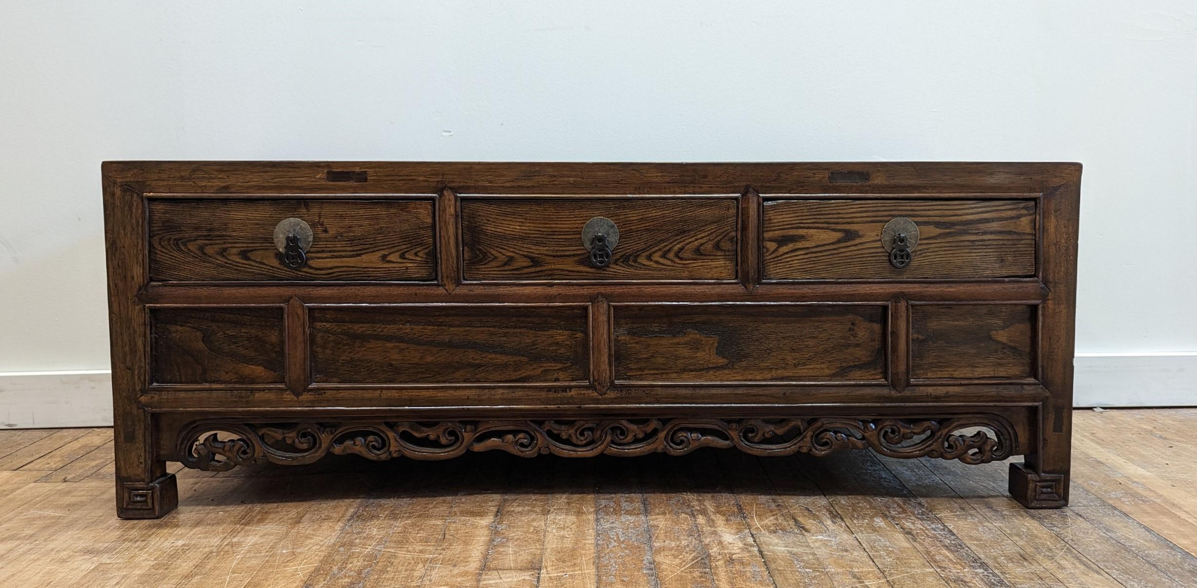 Antique Low Table with three drawers.  Very nice Elm wood low table coffer with drawers, keyed horse hoof feet with a beautiful carved apron.  Wonderful antique low table capable of being used as cocktail table, coffee table, media TV stand, of low